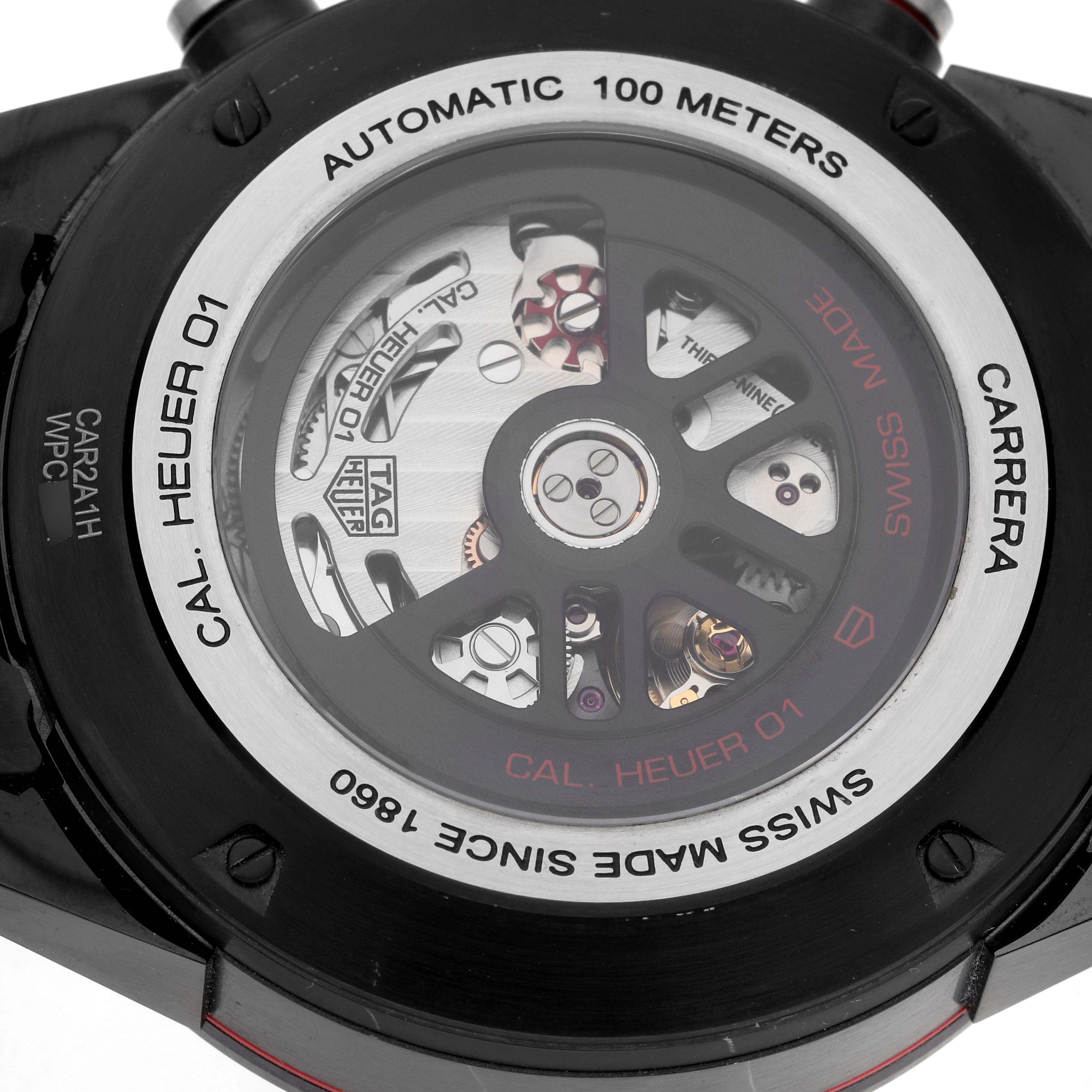 The image shows the back of a Tag Heuer Carrera CAR2A1H Men
s Stainless Steel Transparent Dial watch, highlighting the automatic movement and rotor.