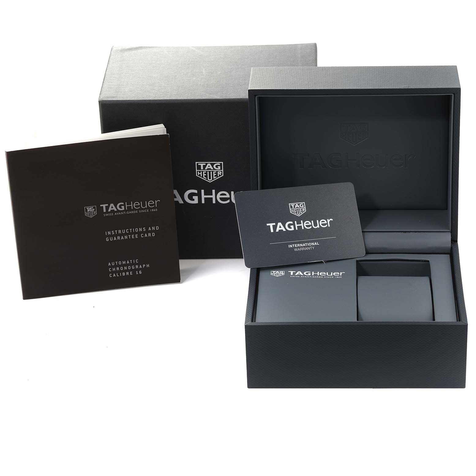 The image shows the packaging and accessories, including a warranty card and instruction booklet, for the Limited Edition Tag Heuer watch.