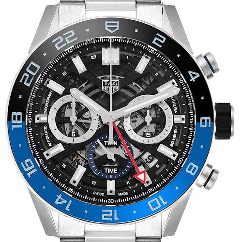 The image displays a frontal view of the Tag Heuer Carrera watch model, showcasing the dial, hands, subdials, and the outer bezel with blue accents.