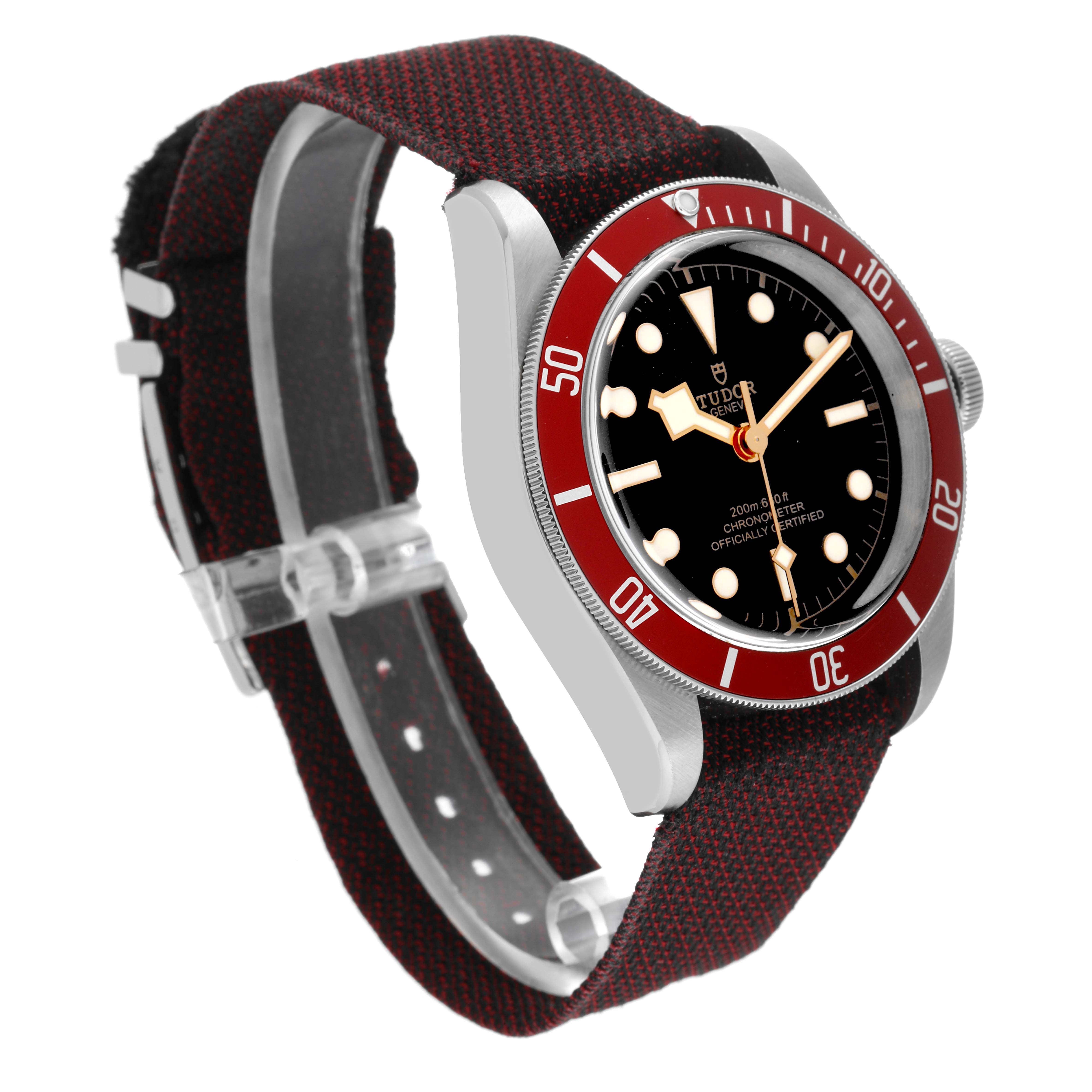 This image shows a side angle of the Tudor Heritage Black Bay 79230R Men's Stainless Steel Black Dial 79230R Men's Stainless Steel Black Dial watch, highlighting its red bezel, black dial, and fabric strap.