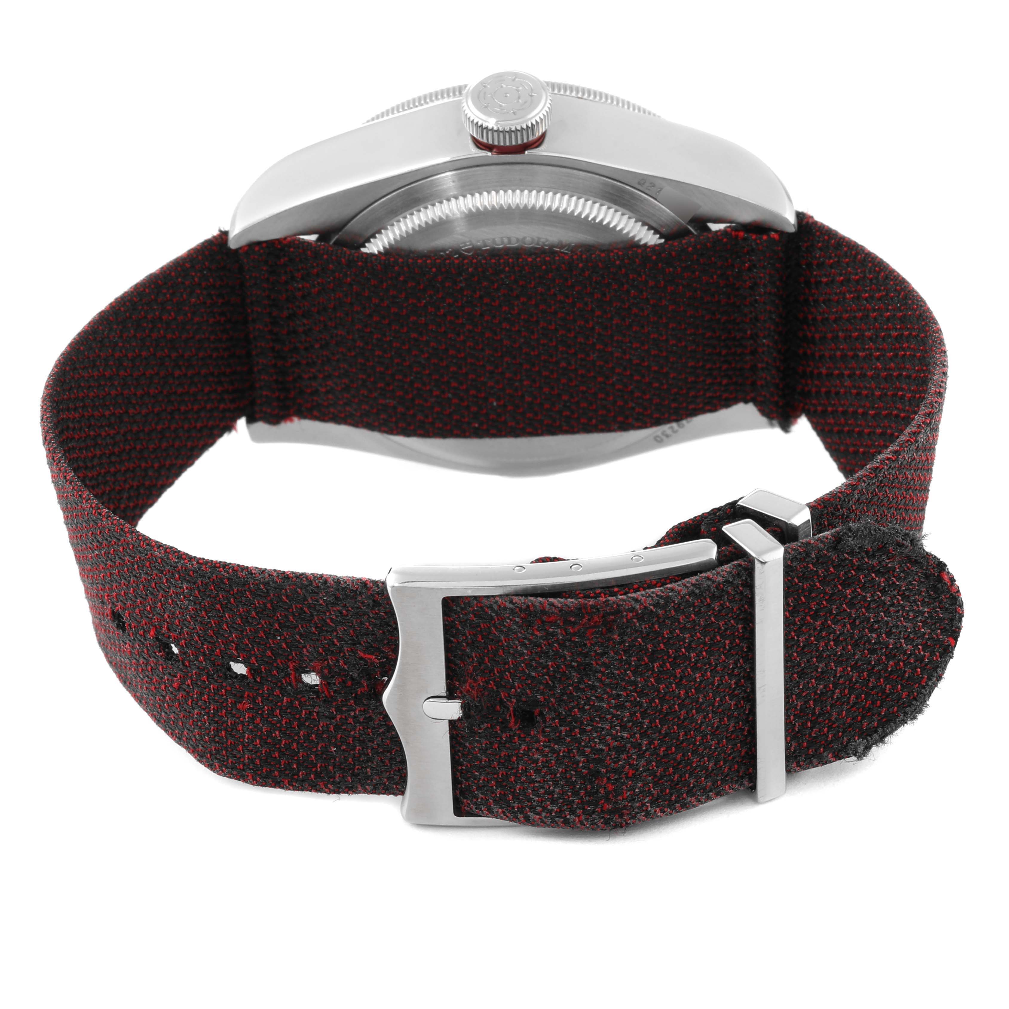 The image shows the back of a Tudor Heritage Black Bay 79230R Men's Stainless Steel Black Dial 79230R Men's Stainless Steel Black Dial watch with a fabric strap and buckle.