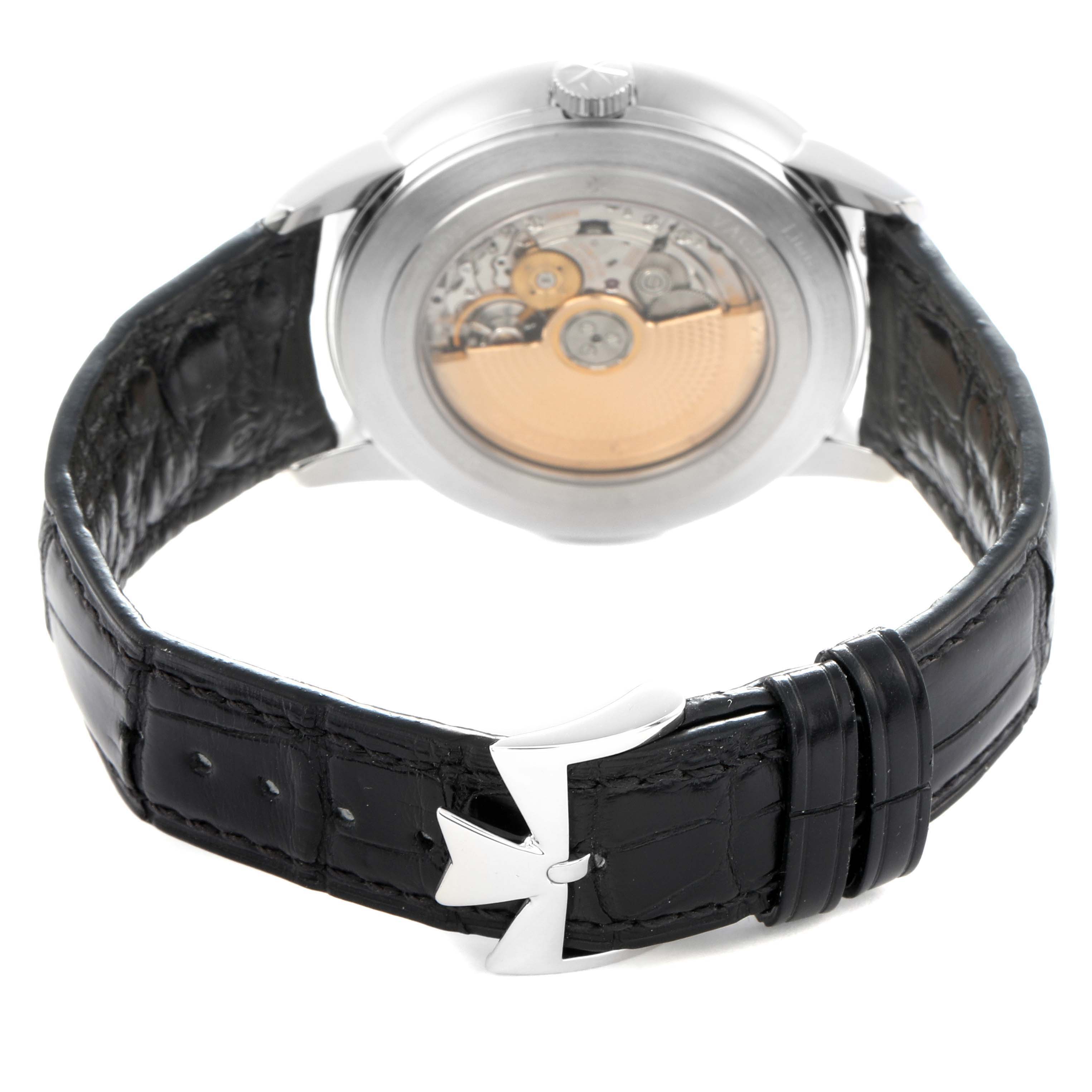 The Vacheron Constantin Patrimony 86020 Men
s Platinum Grey Dial watch is shown from the back, highlighting the movement through a clear case and a leather strap with a clasp.