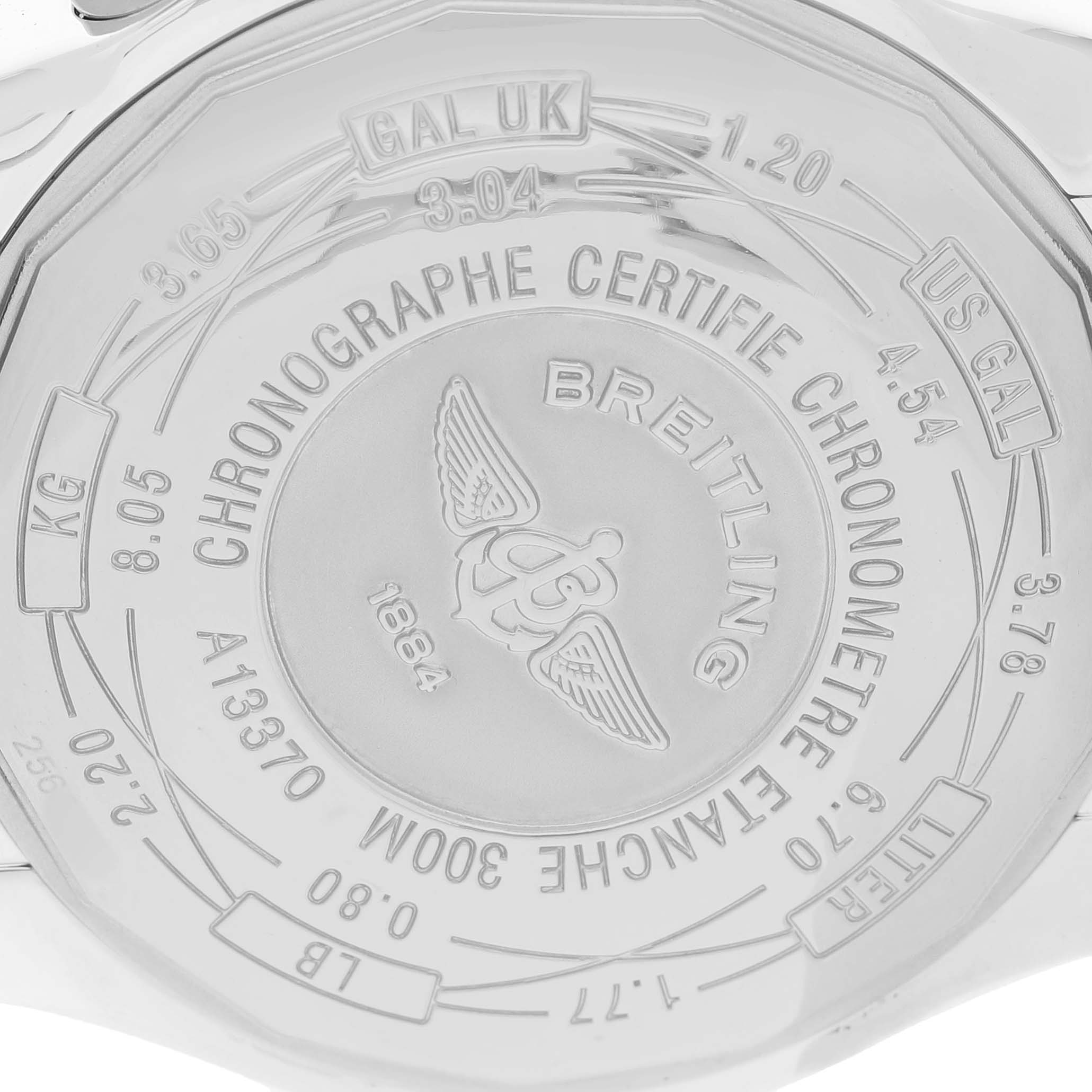 The image shows the back case of a Breitling Avenger A1337011/A699 Men's Stainless Steel White Dial watch, featuring engraved text and logos.