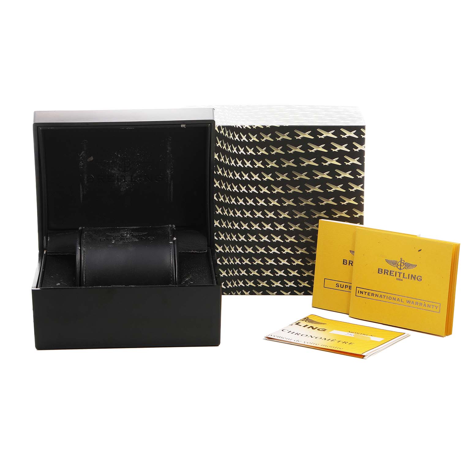 The image shows the packaging and documentation for a Breitling Avenger A1337011/A699 Men's Stainless Steel White Dial watch, including a box and warranty papers.
