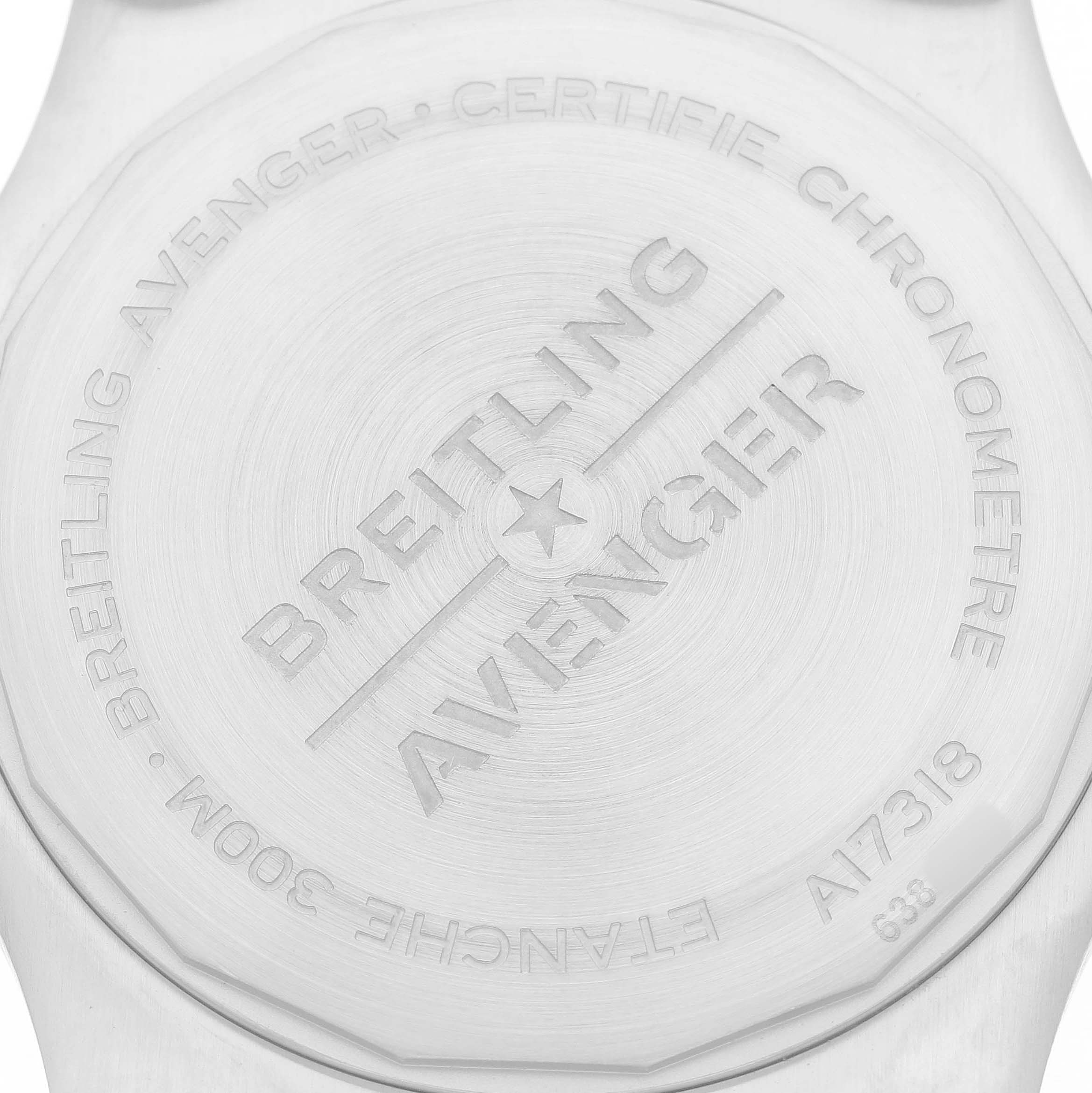 The image shows the back case of a Breitling Avenger A17318 Men's Stainless Steel Blue Dial watch with engraved text.