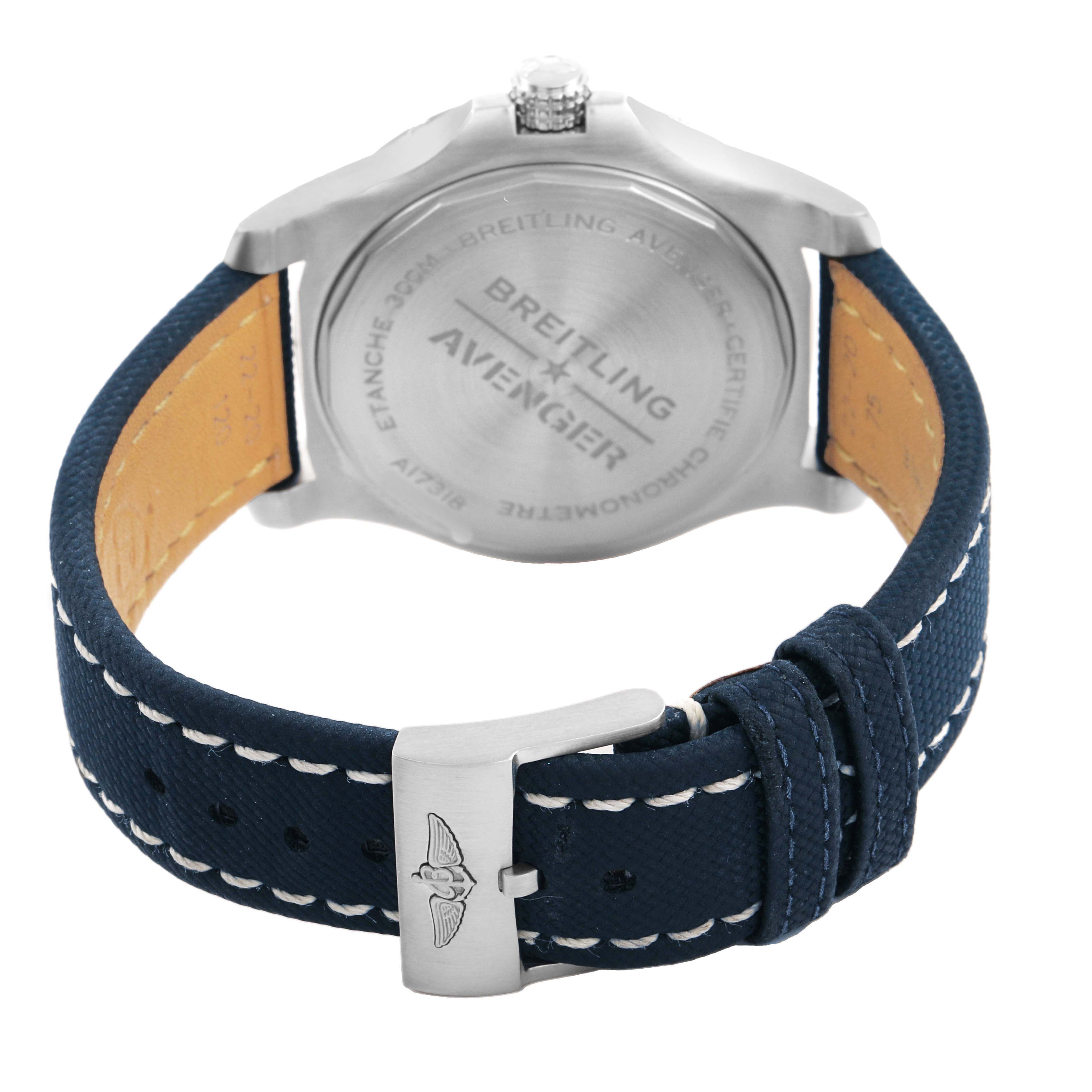 The image shows the backside of a Breitling Avenger A17318 Men's Stainless Steel Blue Dial watch, highlighting the case back and blue strap with buckle.