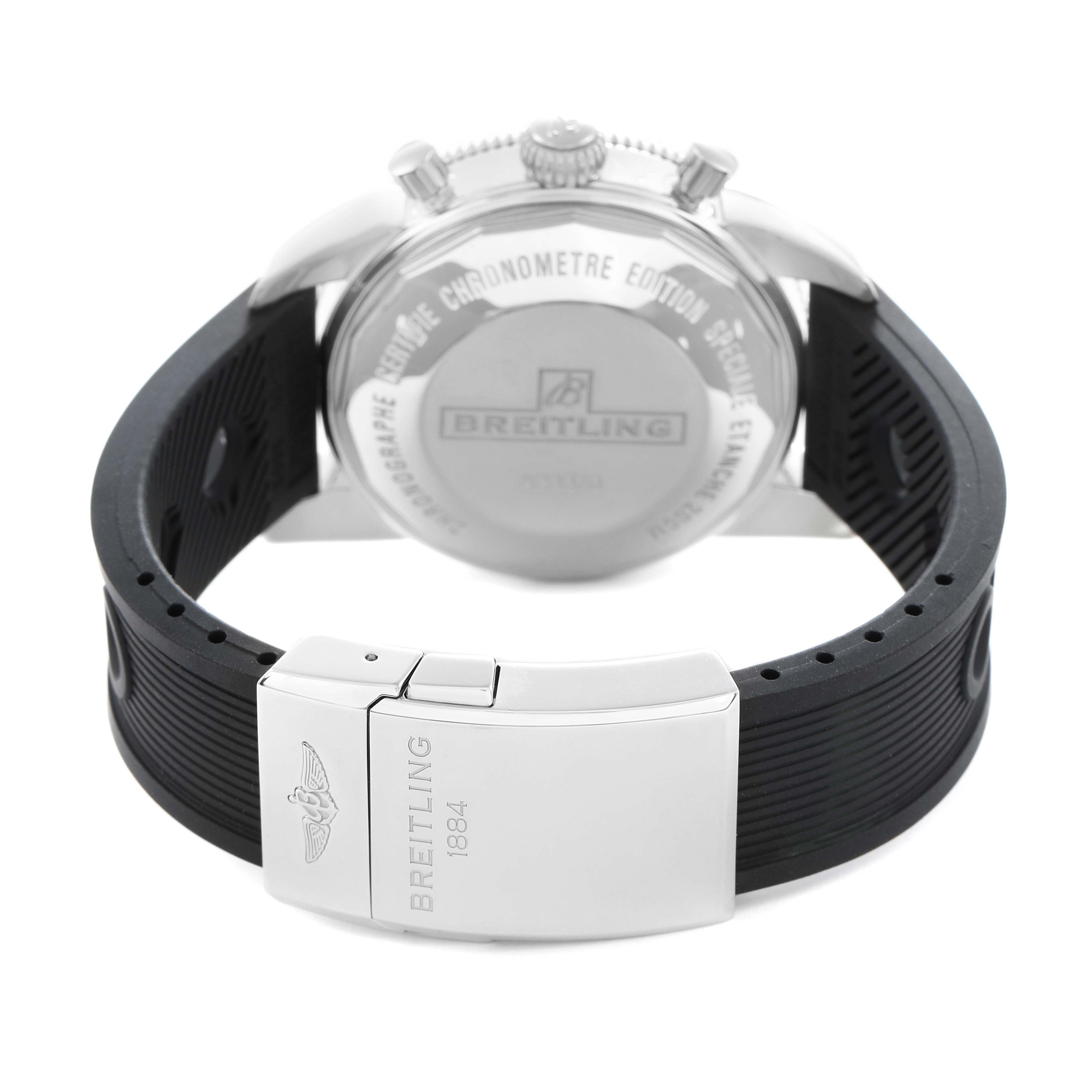The image shows the back of a Breitling Superocean A23370 Men
s Stainless Steel Black Dial watch and its black strap, focusing on the clasp and case back.