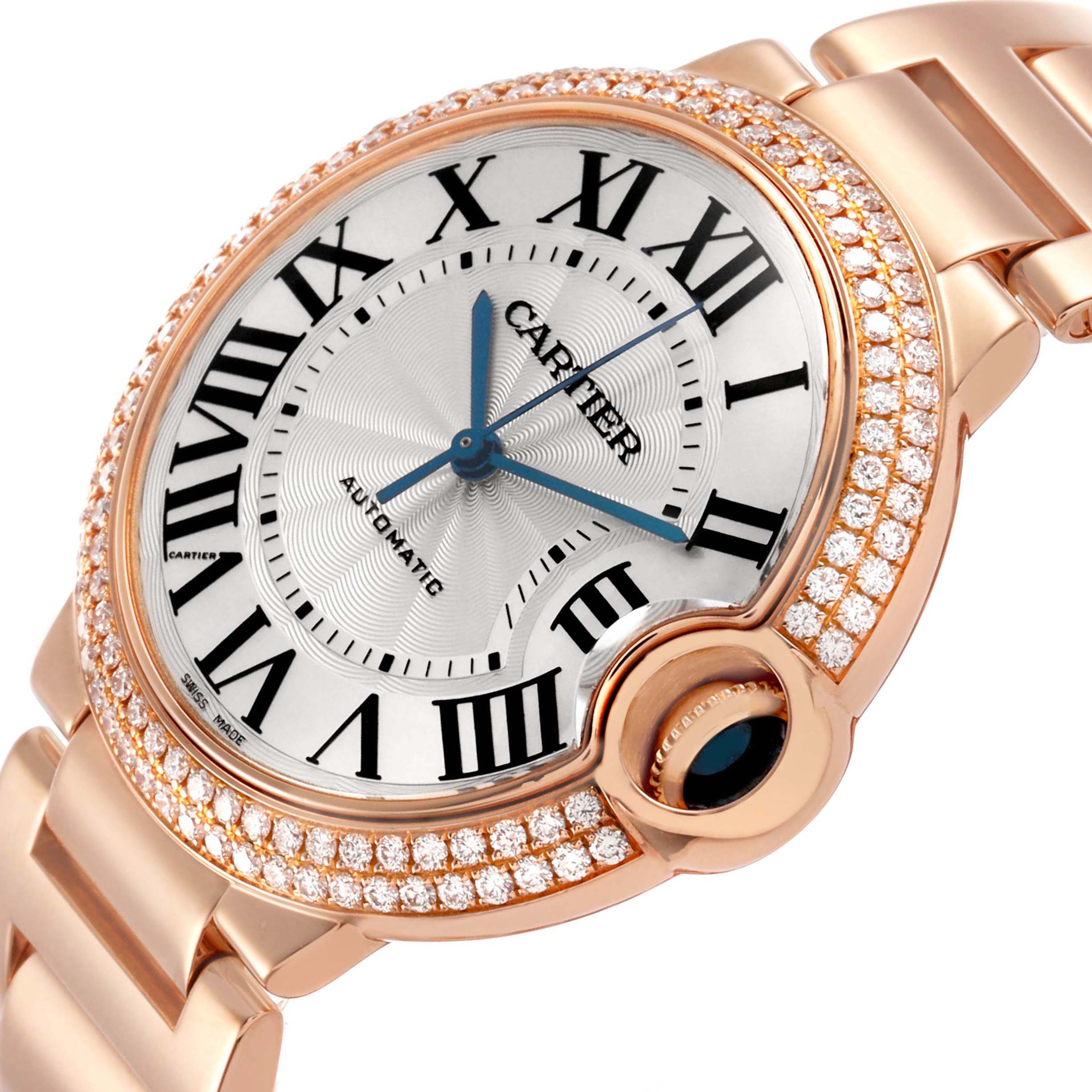 The Cartier Ballon Bleu WE9005Z3 Women's Rose Gold Silver Dial watch is shown at an angled view, featuring a diamond-studded bezel, Roman numerals, and a metal bracelet.