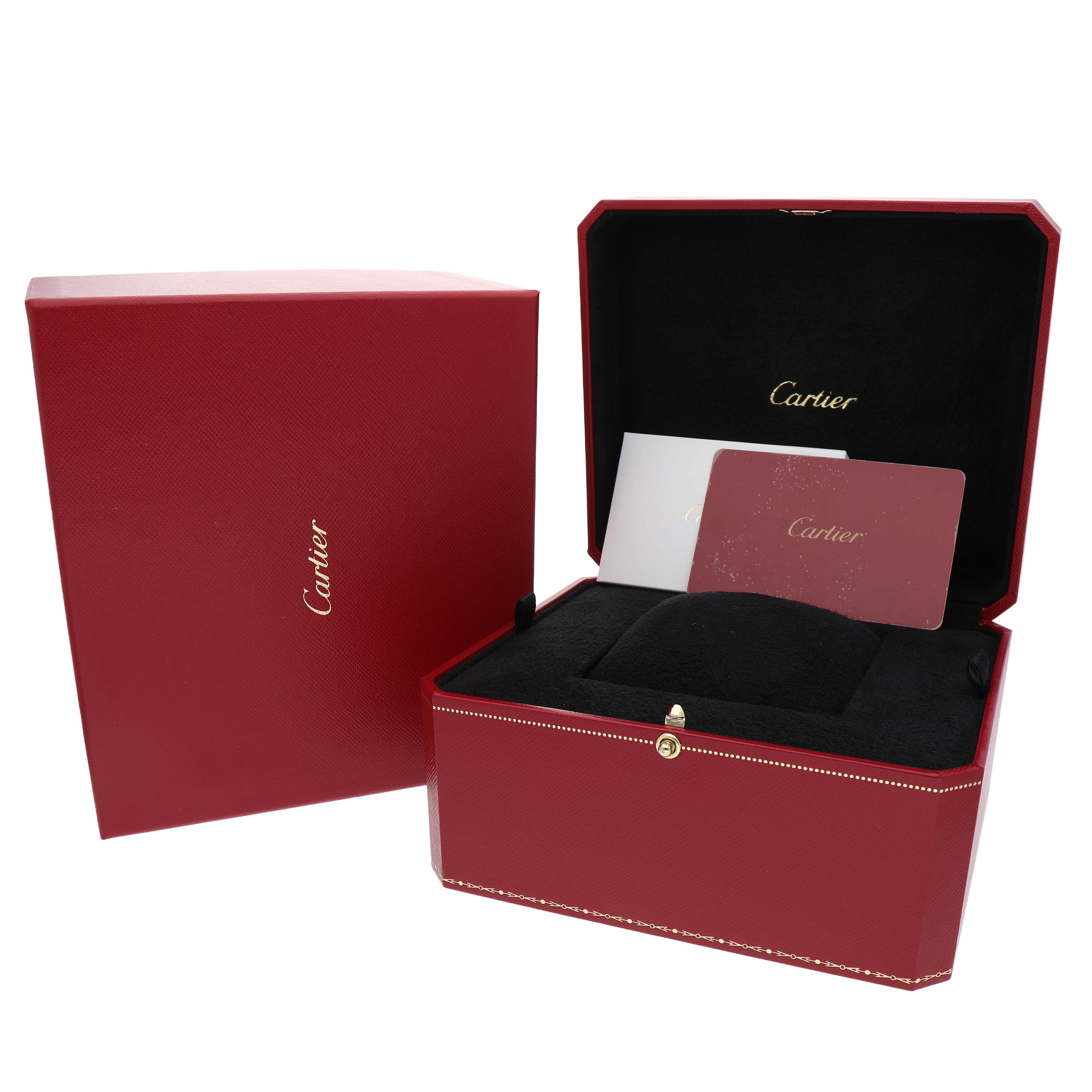 This image shows the Ballon Bleu model by Cartier's red box and paperwork, with the watch itself not visible.