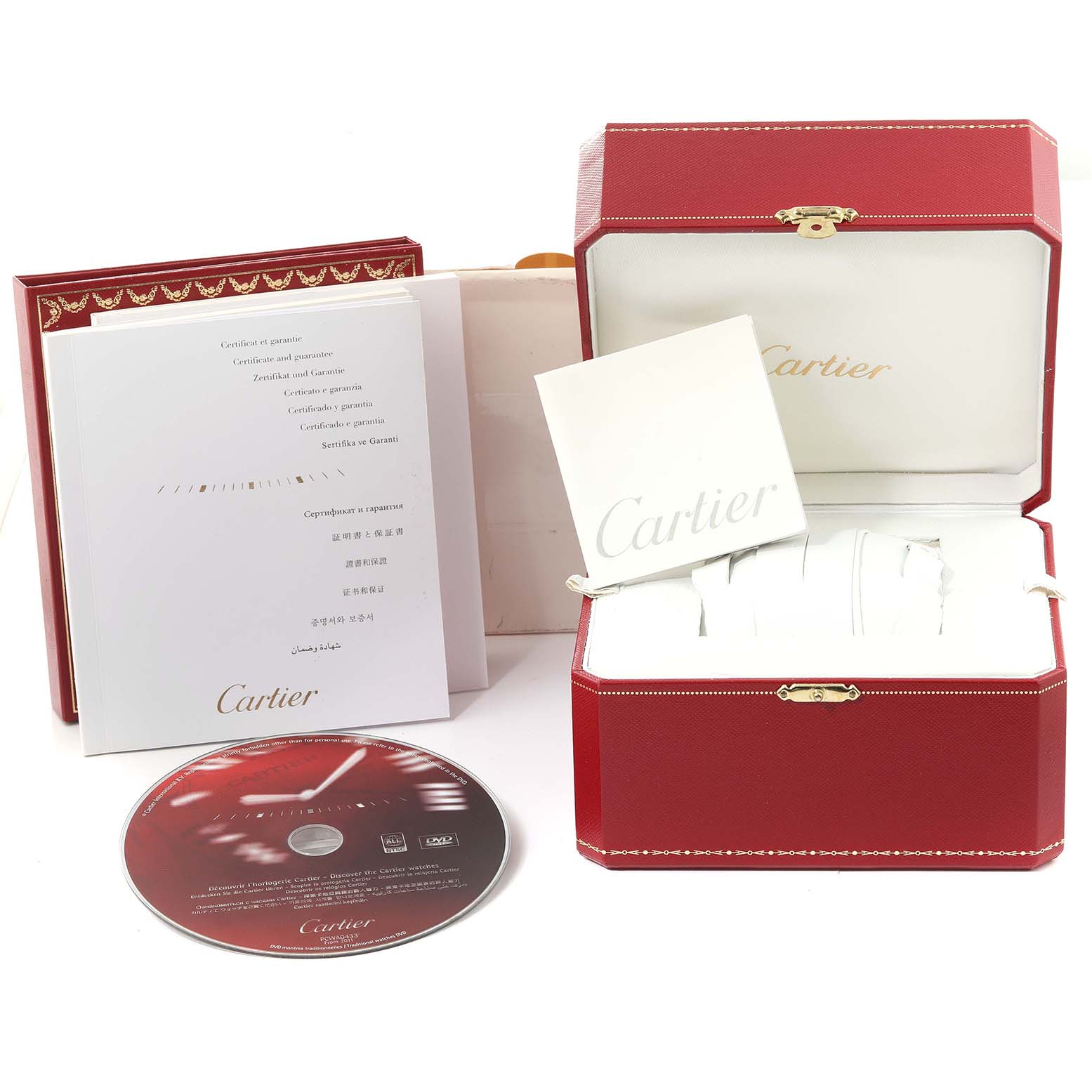 This image shows the packaging, documentation, and a DVD for the Ballon Bleu model by Cartier, including the watch box and booklets.