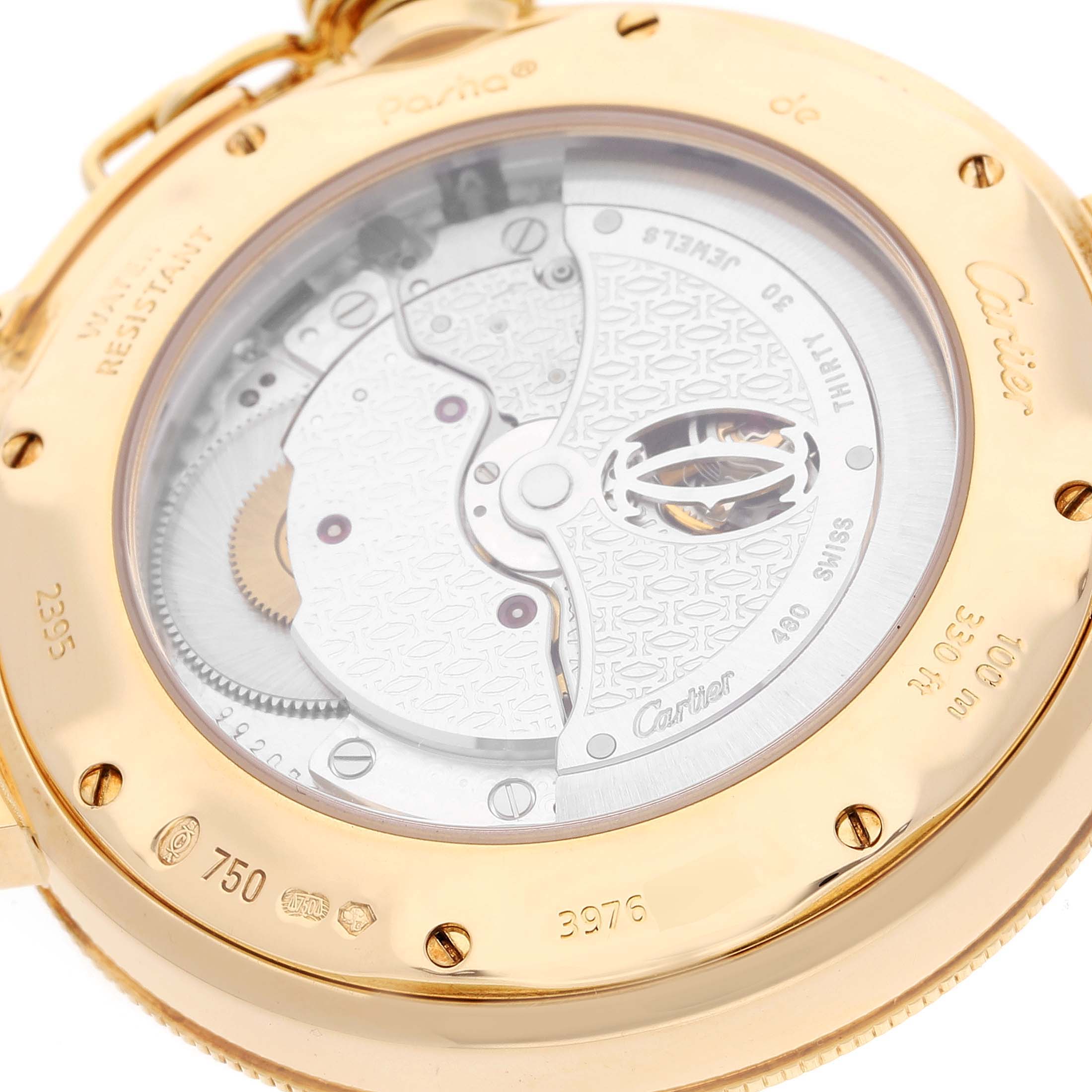 The image shows the back case of the Cartier Pasha W30144D1 Men's Yellow Gold Silver Dial W30144D1 Men's Yellow Gold Silver Dial watch, highlighting the mechanical movement and engravings.