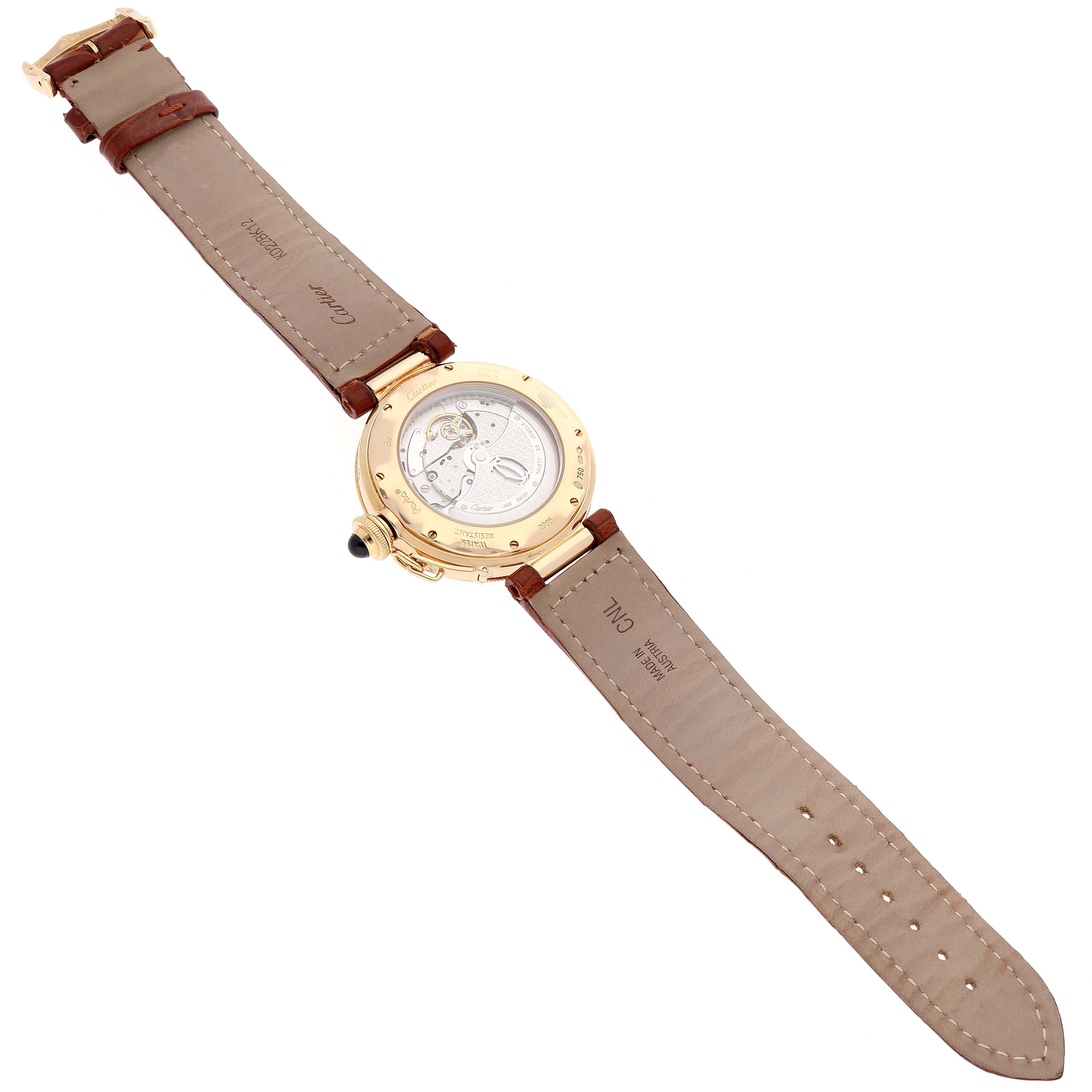 The image shows the back view of a Cartier Pasha W30144D1 Men's Yellow Gold Silver Dial W30144D1 Men's Yellow Gold Silver Dial watch, highlighting the leather strap and watch movement.