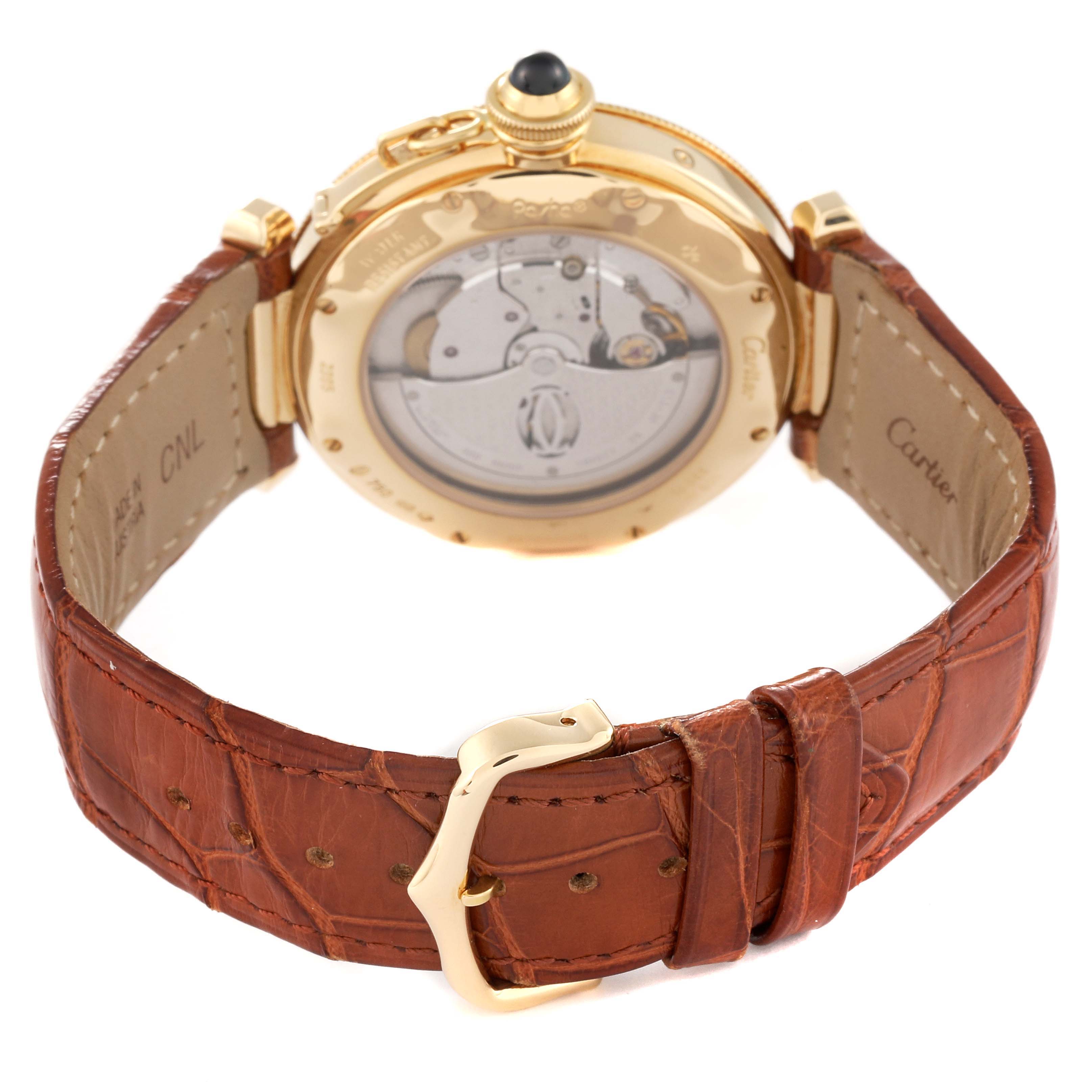 The image shows the back view of a Cartier Pasha W30144D1 Men's Yellow Gold Silver Dial W30144D1 Men's Yellow Gold Silver Dial model watch, highlighting its transparent case back and brown leather strap.