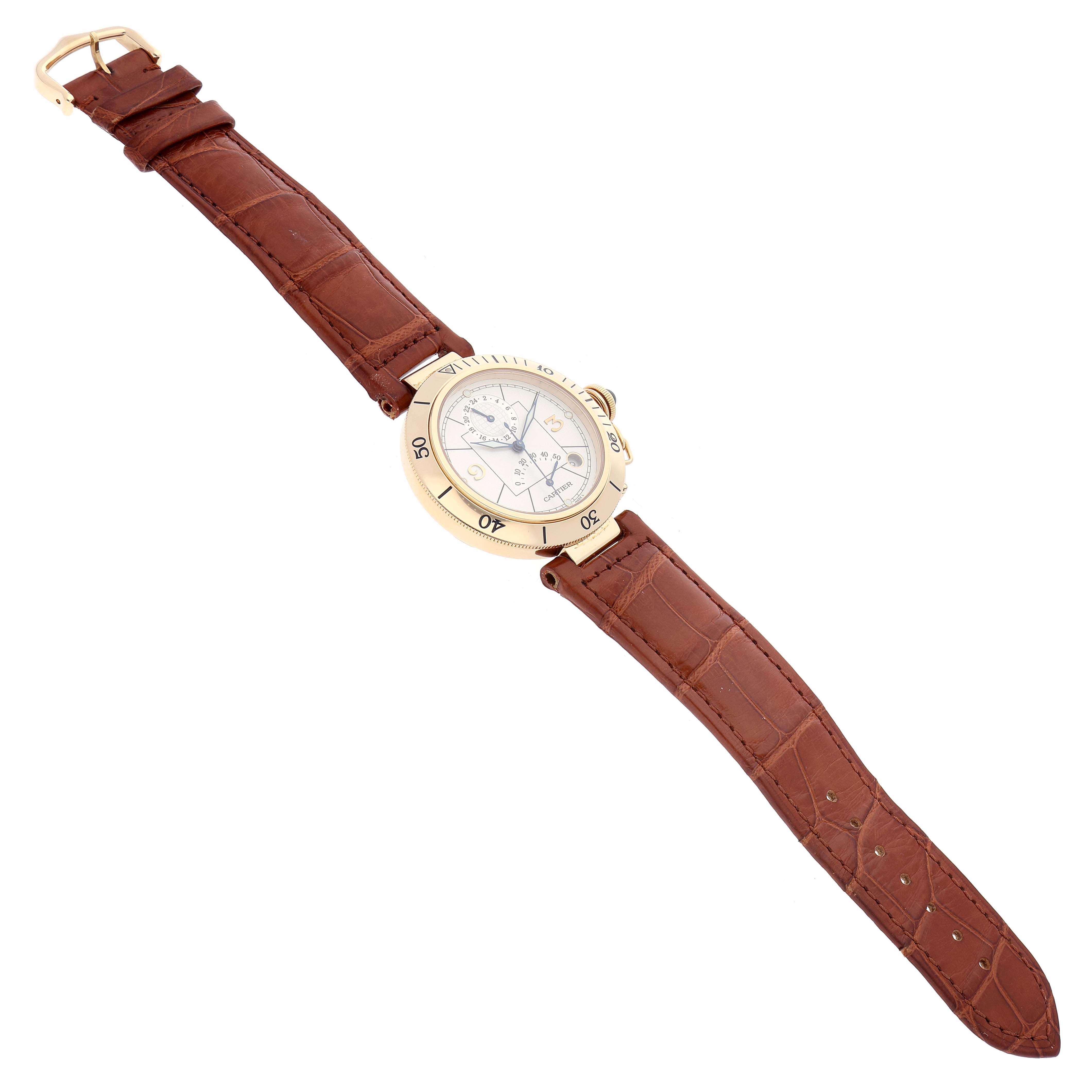 The image shows a Cartier Pasha W30144D1 Men's Yellow Gold Silver Dial W30144D1 Men's Yellow Gold Silver Dial watch lying flat, displaying its brown leather strap and round gold case with a side view of the crown.