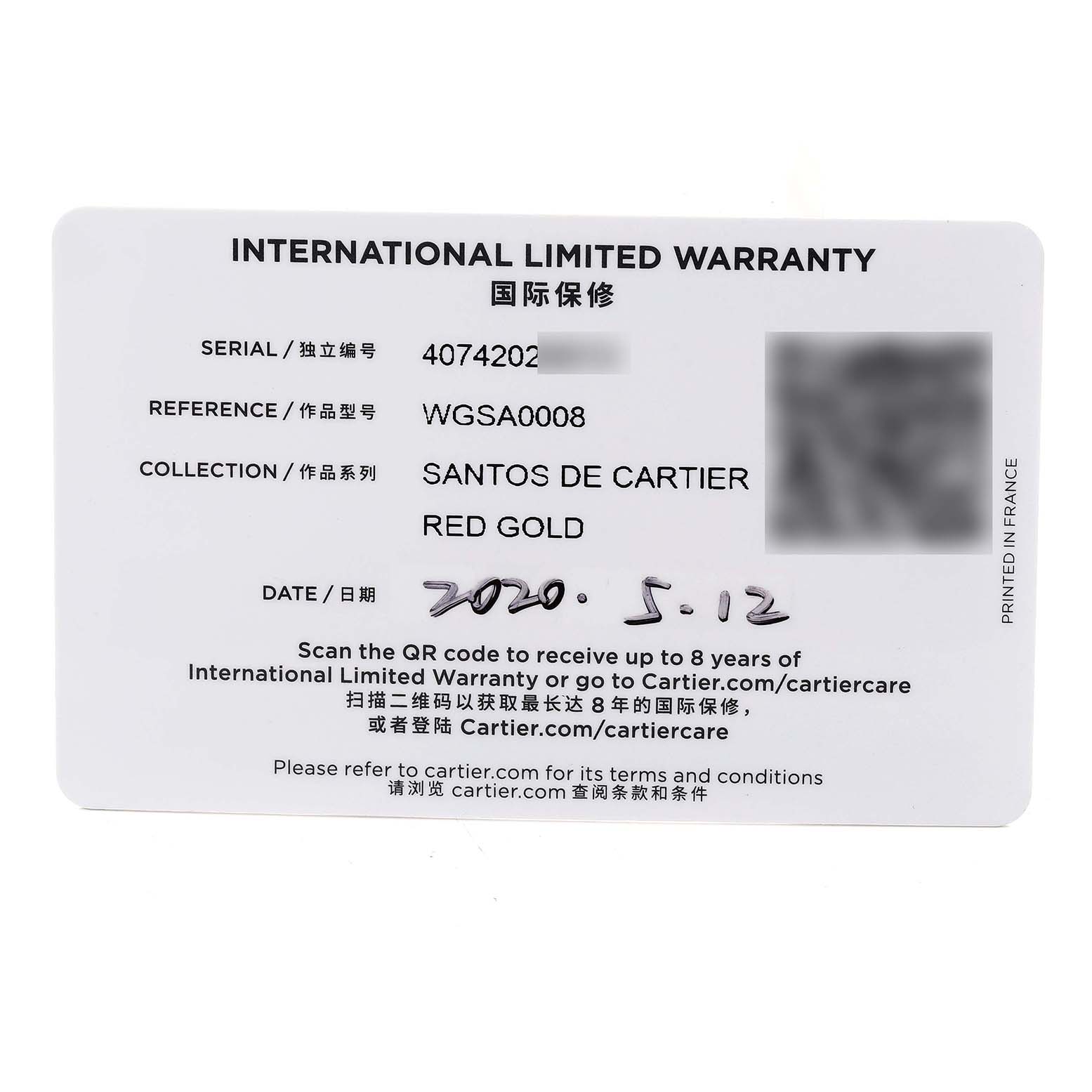 This image shows the International Limited Warranty card for the Santos de Cartier Red Gold model, viewed from a top-down angle.