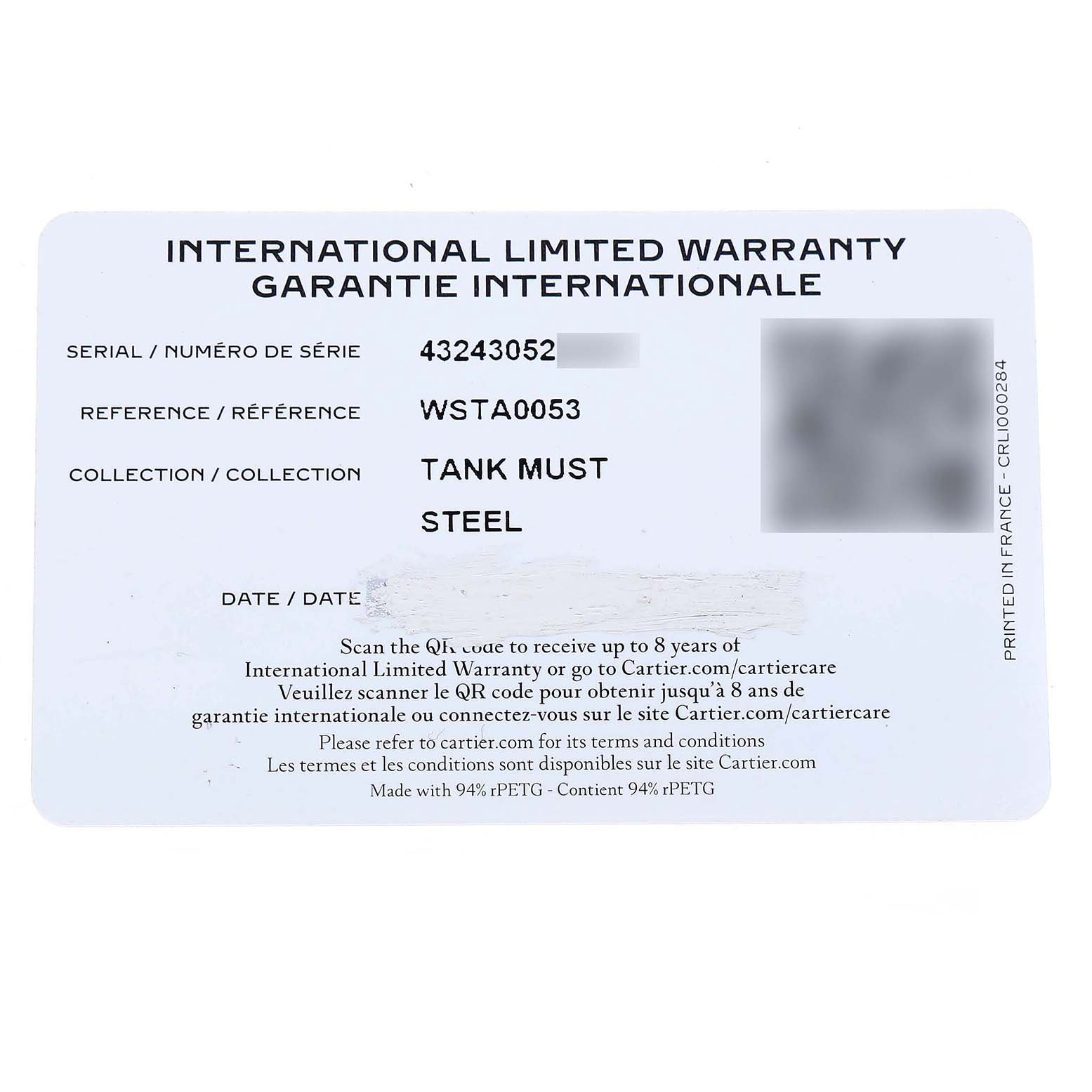 The image shows an international limited warranty card for the Cartier Tank Must WSTA0053 Men's Stainless Steel Silver Dial model.