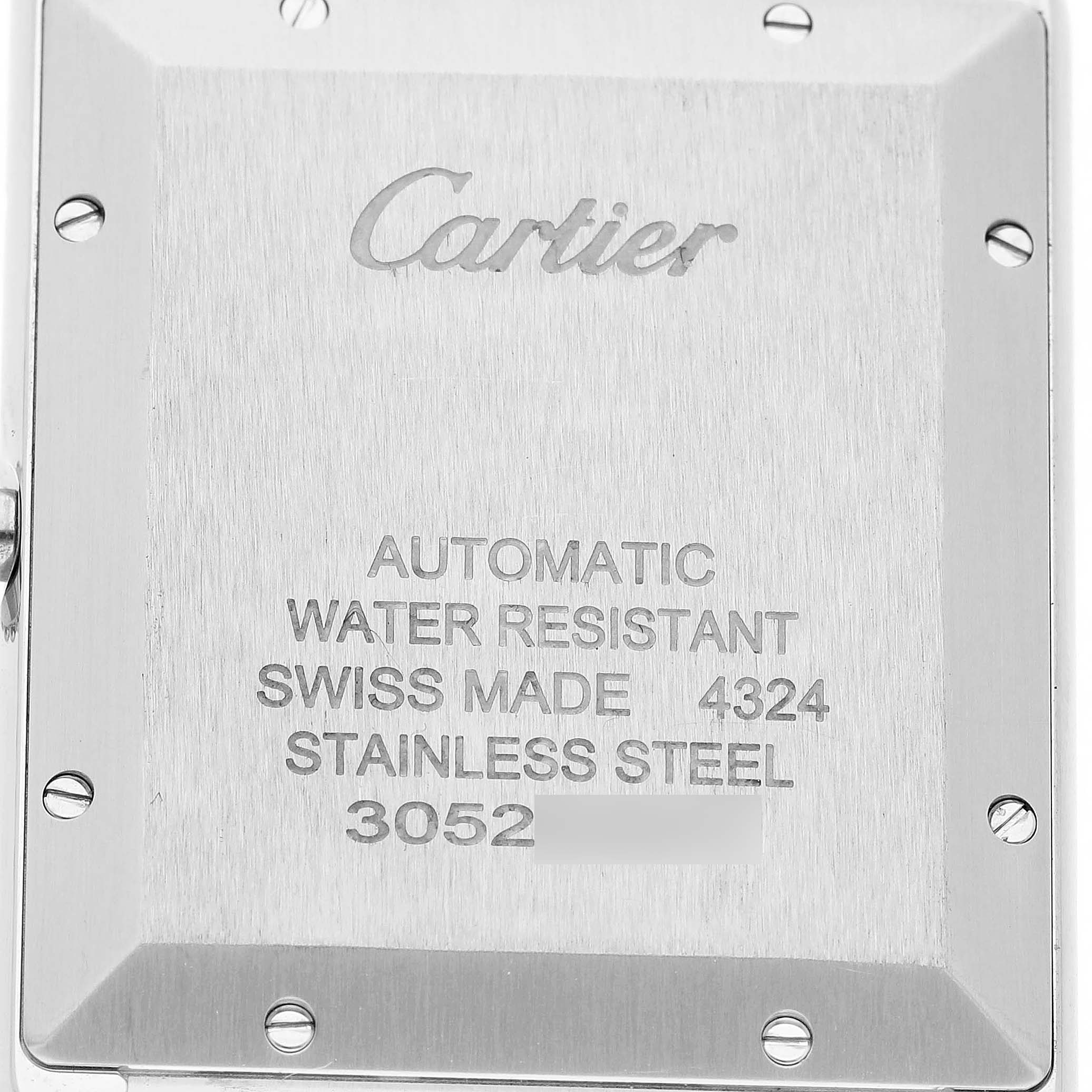 This image shows the back of a Cartier Tank Must WSTA0053 Men's Stainless Steel Silver Dial watch, featuring engraved details such as the brand and specifications.