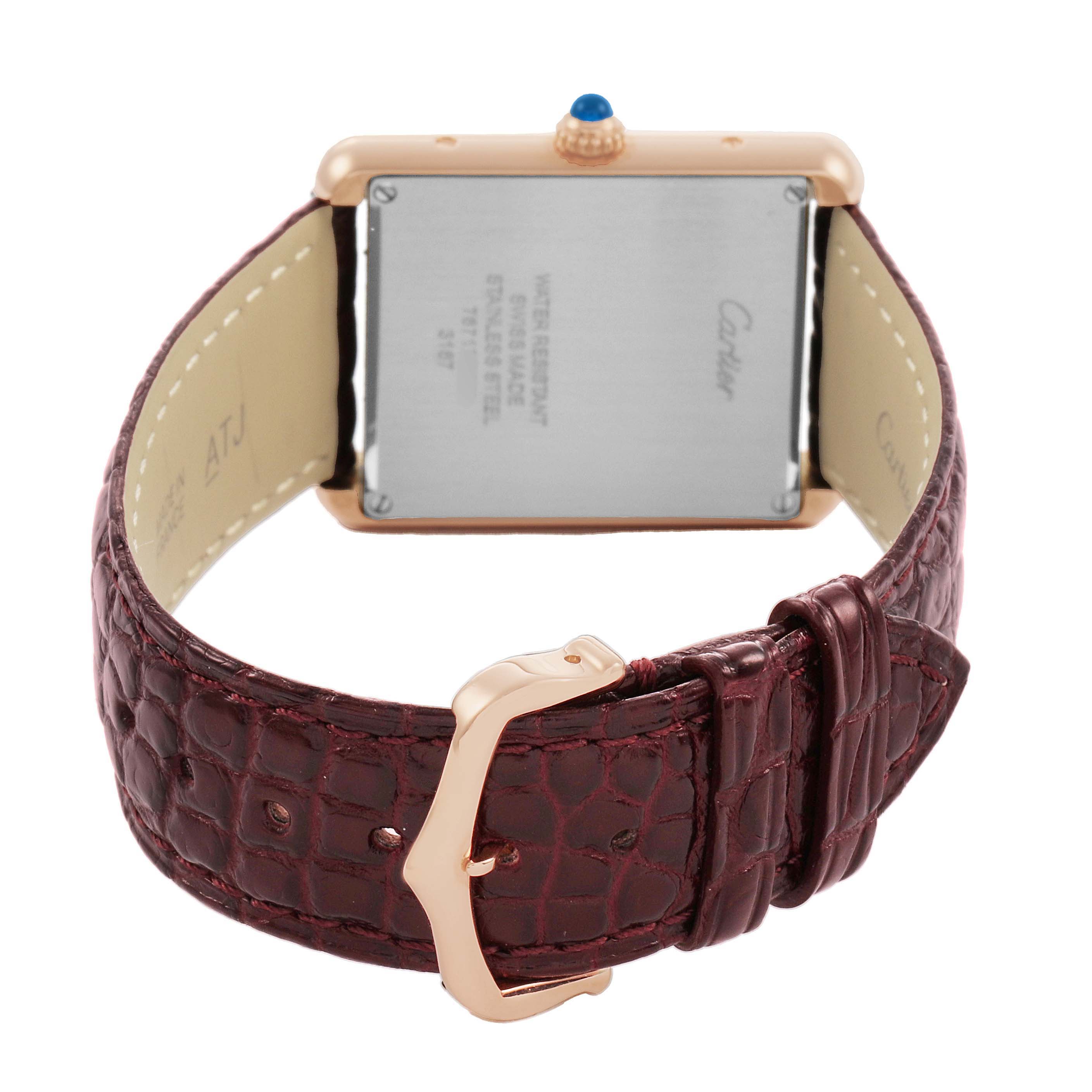 The Cartier Tank Solo W5200025 Men's Rose Gold Silver Dial watch is shown from the back, highlighting its case, leather strap, and buckle.