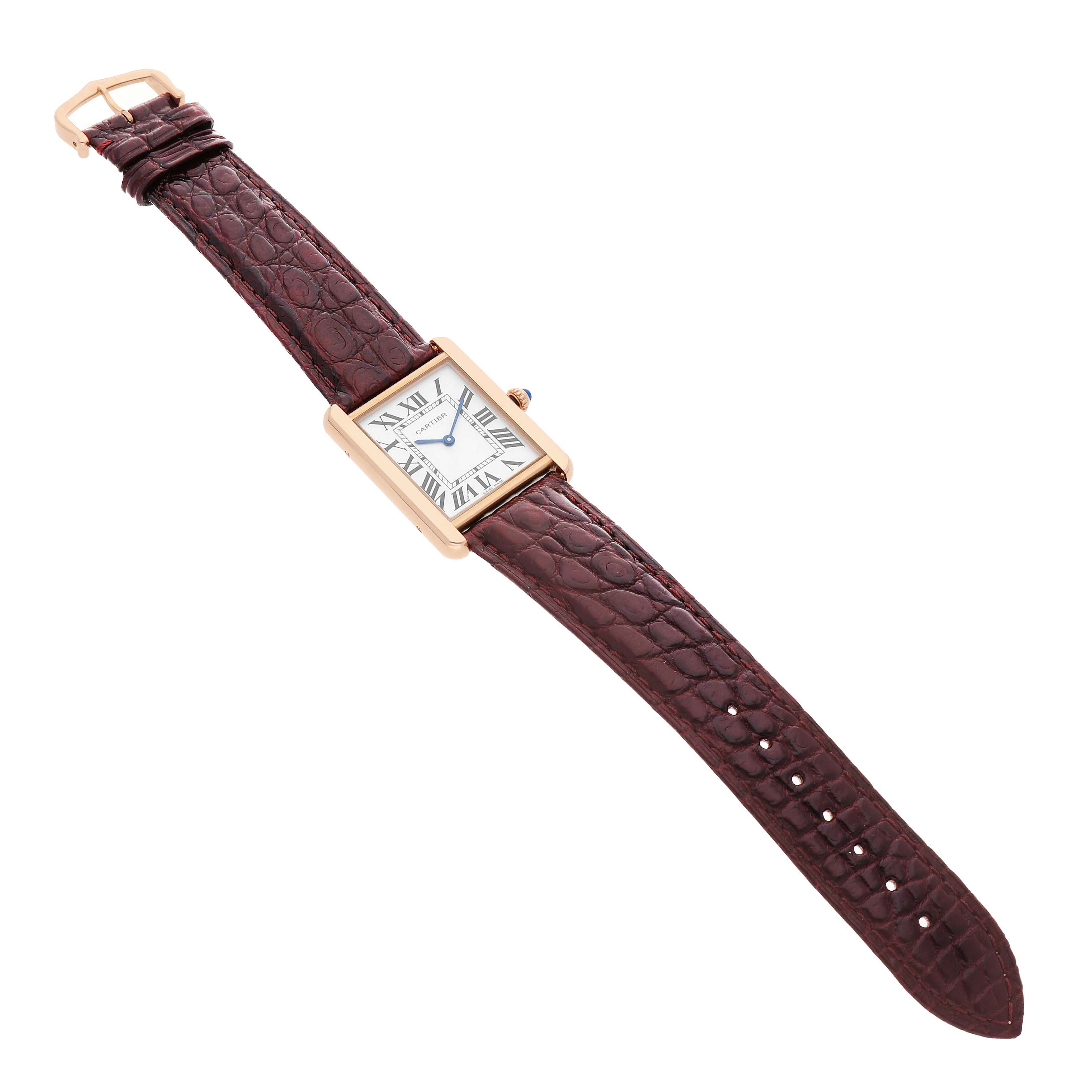 The Cartier Tank Solo W5200025 Men's Rose Gold Silver Dial watch is shown at an angled top view, displaying its rectangular case, Roman numeral dial, and brown leather strap.