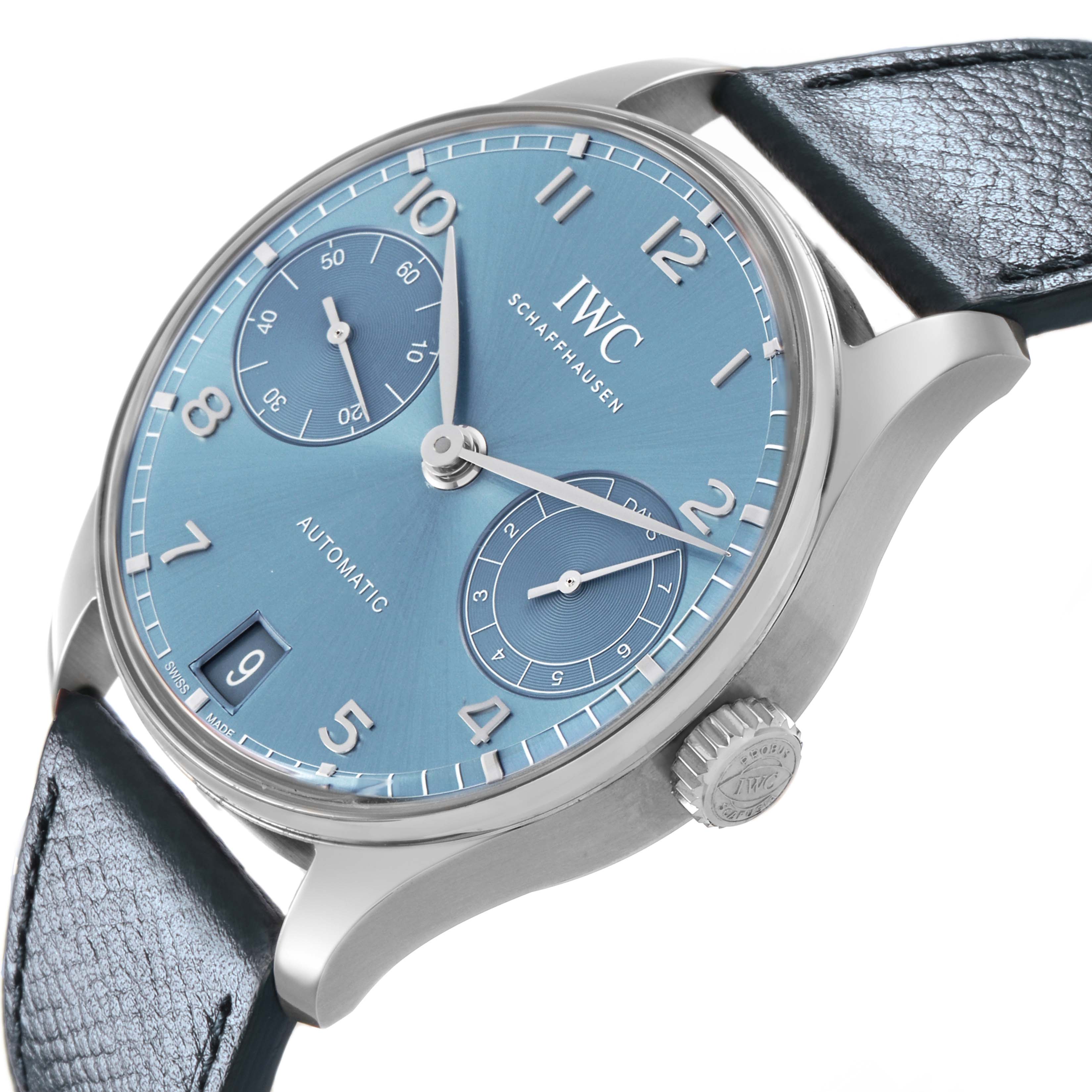 The IWC Portuguese IW501708 Men's White Gold Blue Dial watch is shown at an angled side view, highlighting the blue dial, leather strap, and crown with logo detail.