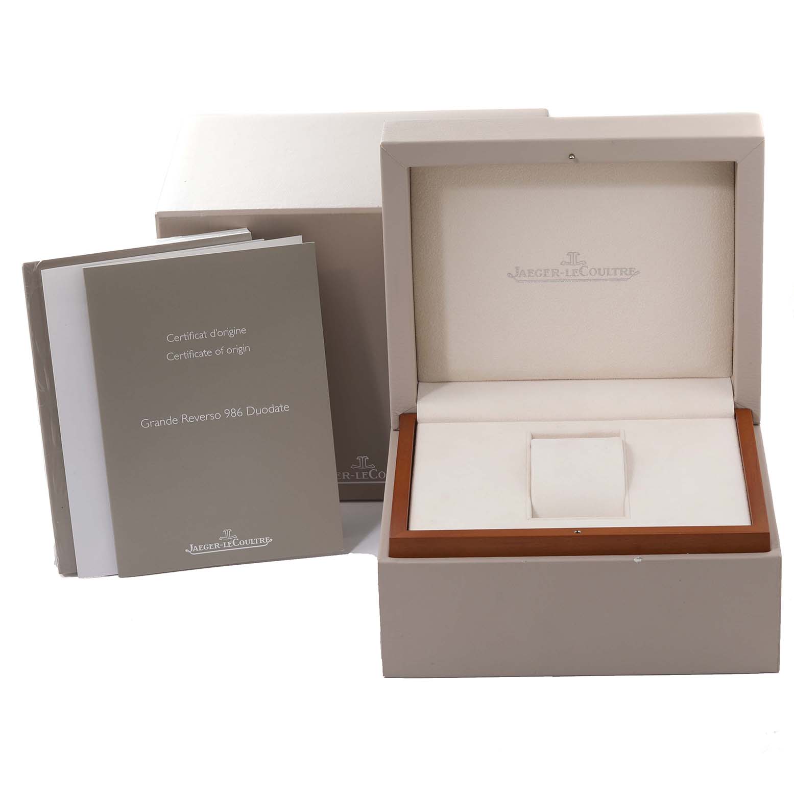 The image shows an open Jaeger LeCoultre Grande Reverso watch box with accompanying certificates.