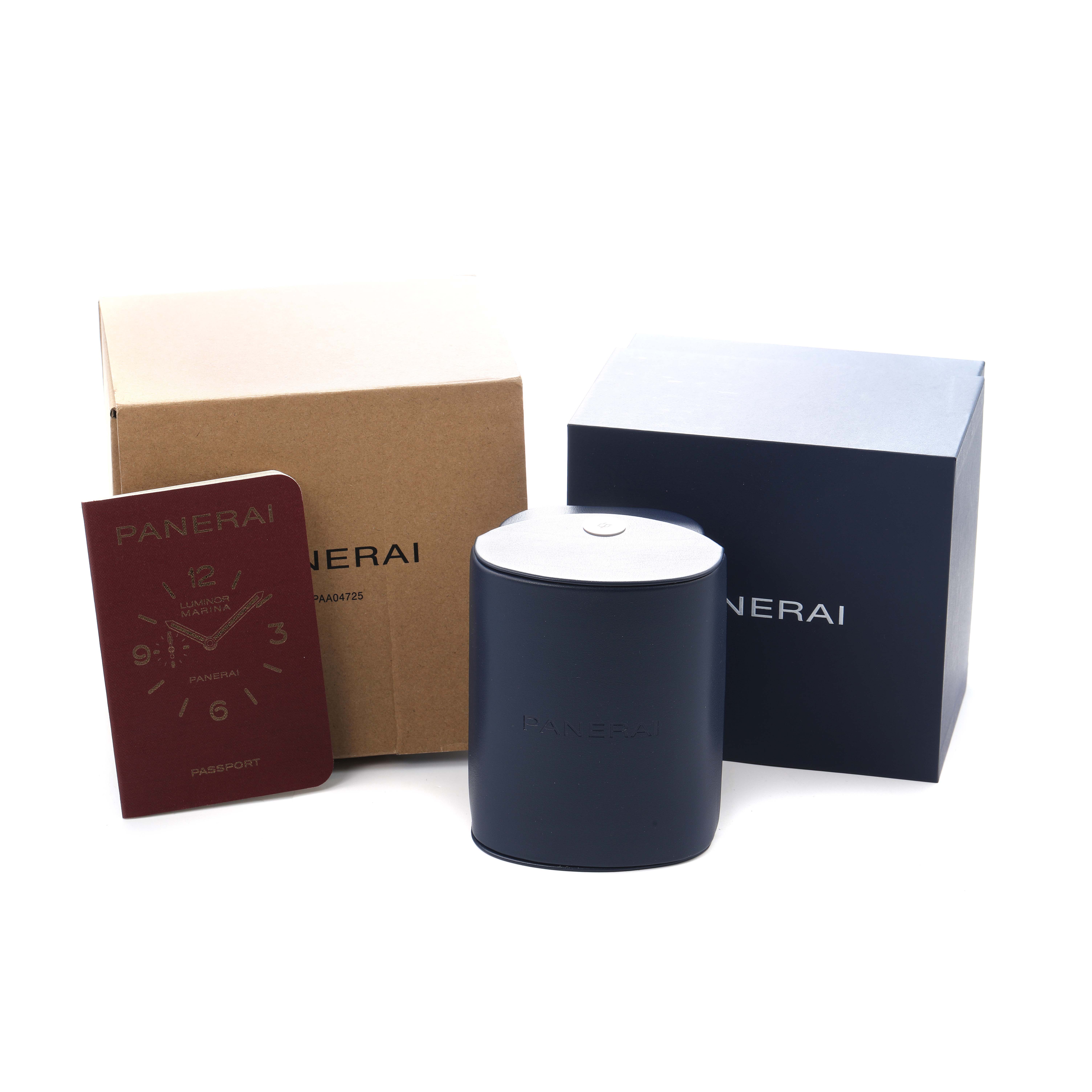 The image shows packaging and accessories for a Panerai Submersible PAM01289 Men's Stainless Steel Blue Dial watch, including a box, container, and booklet.