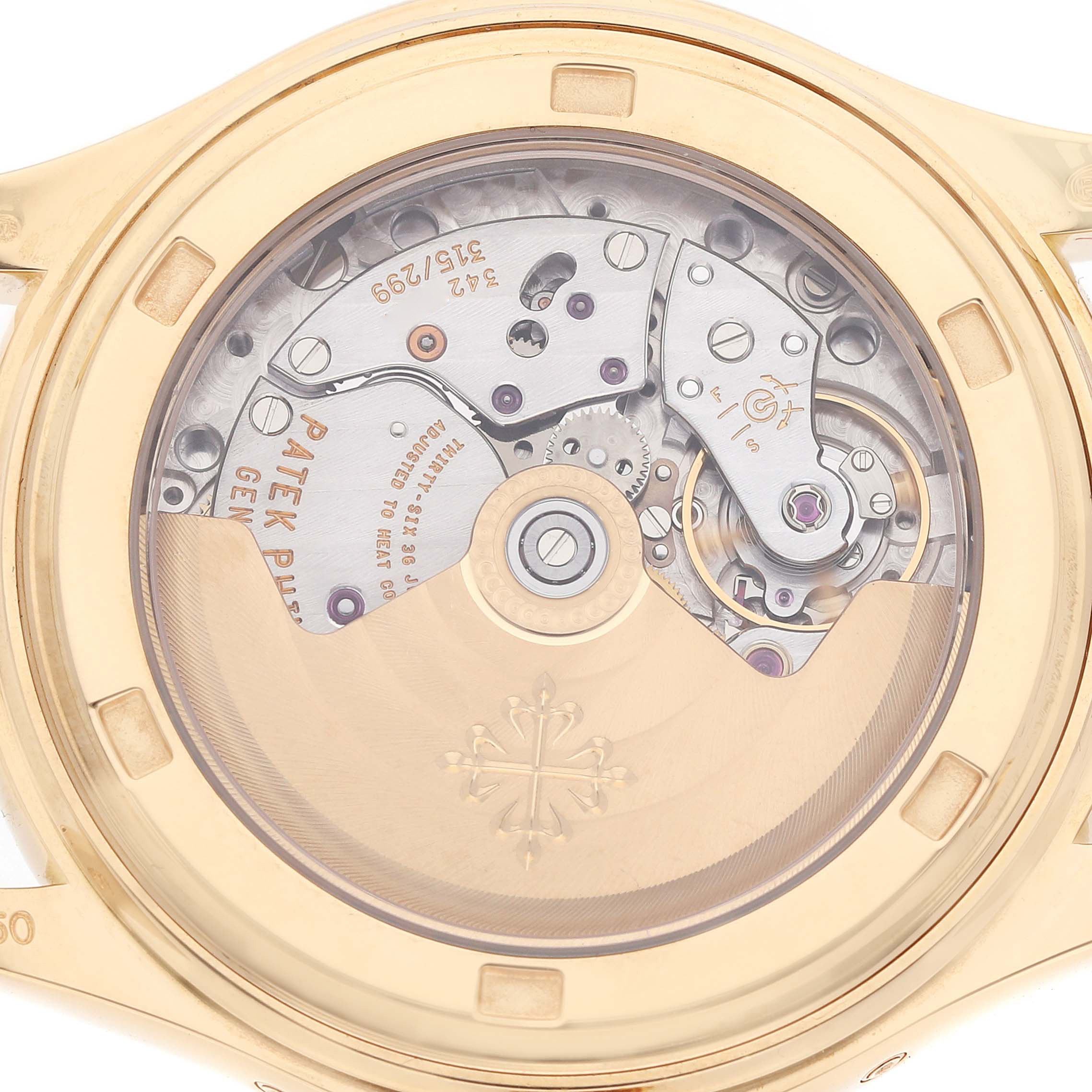 The image shows the back view of a Patek Philippe Complications 5146J Men's Yellow Gold White Dial model, highlighting its intricate mechanical movement.