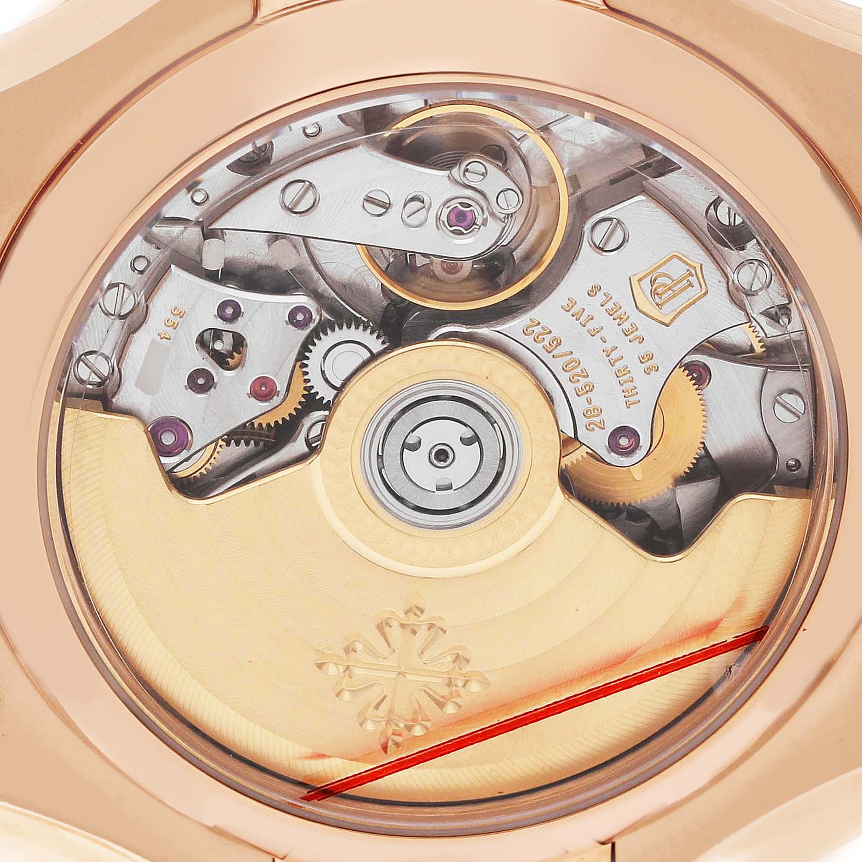 The image shows the back of a Patek Philippe Nautilus 5980R-001 Men's Rose Gold Brown Dial, highlighting the intricate movement and rotor details.