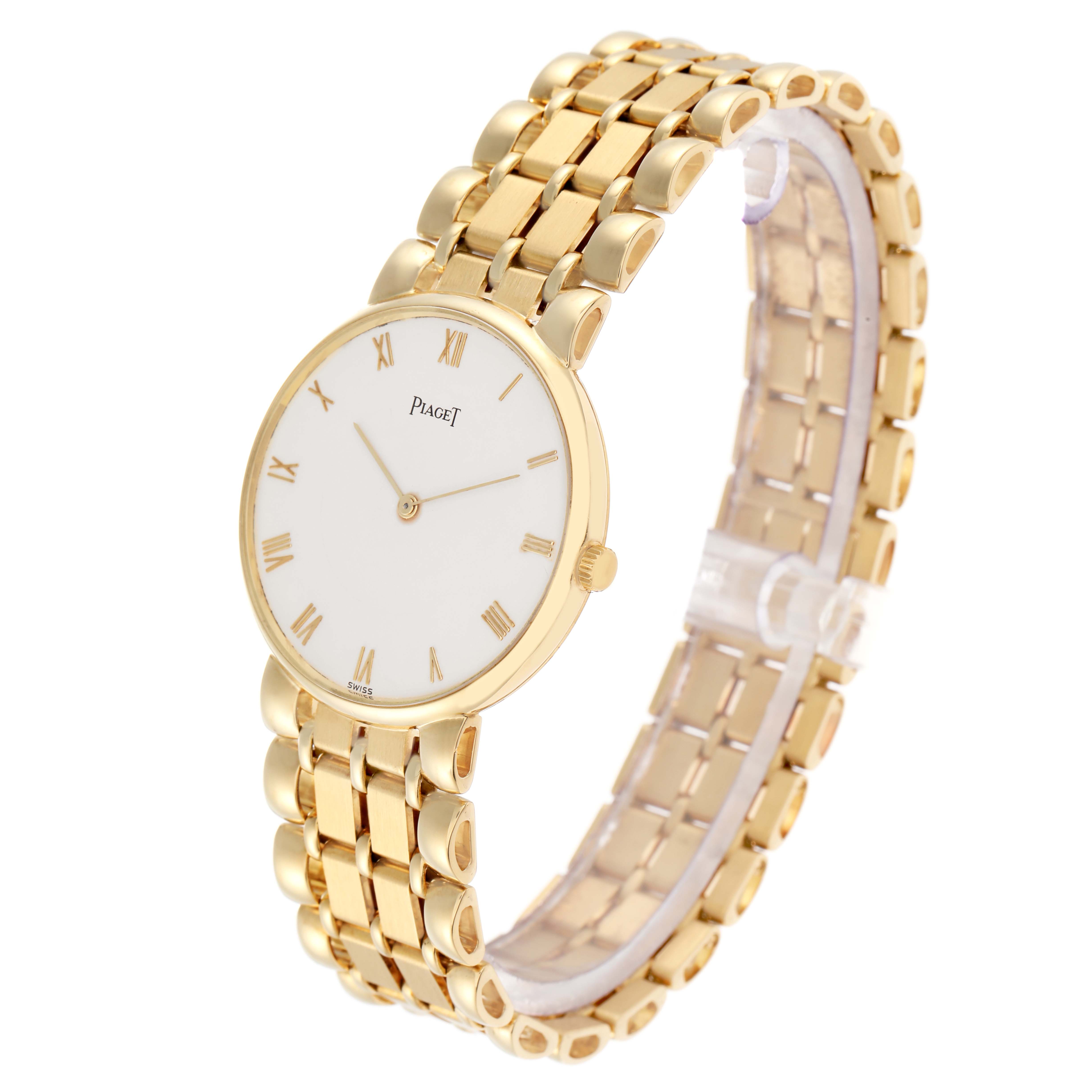 The Piaget 8065K43 Women
s Yellow Gold White Dial 8065K43 watch is shown at a three-quarter angle, highlighting its yellow gold bracelet, white dial, and Roman numerals.