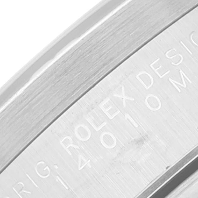 This image shows a close-up of the engraved side of the bezel from a Rolex Air-King 14010 Men's Stainless Steel Blue Dial 14010 Men's Stainless Steel Blue Dial watch.