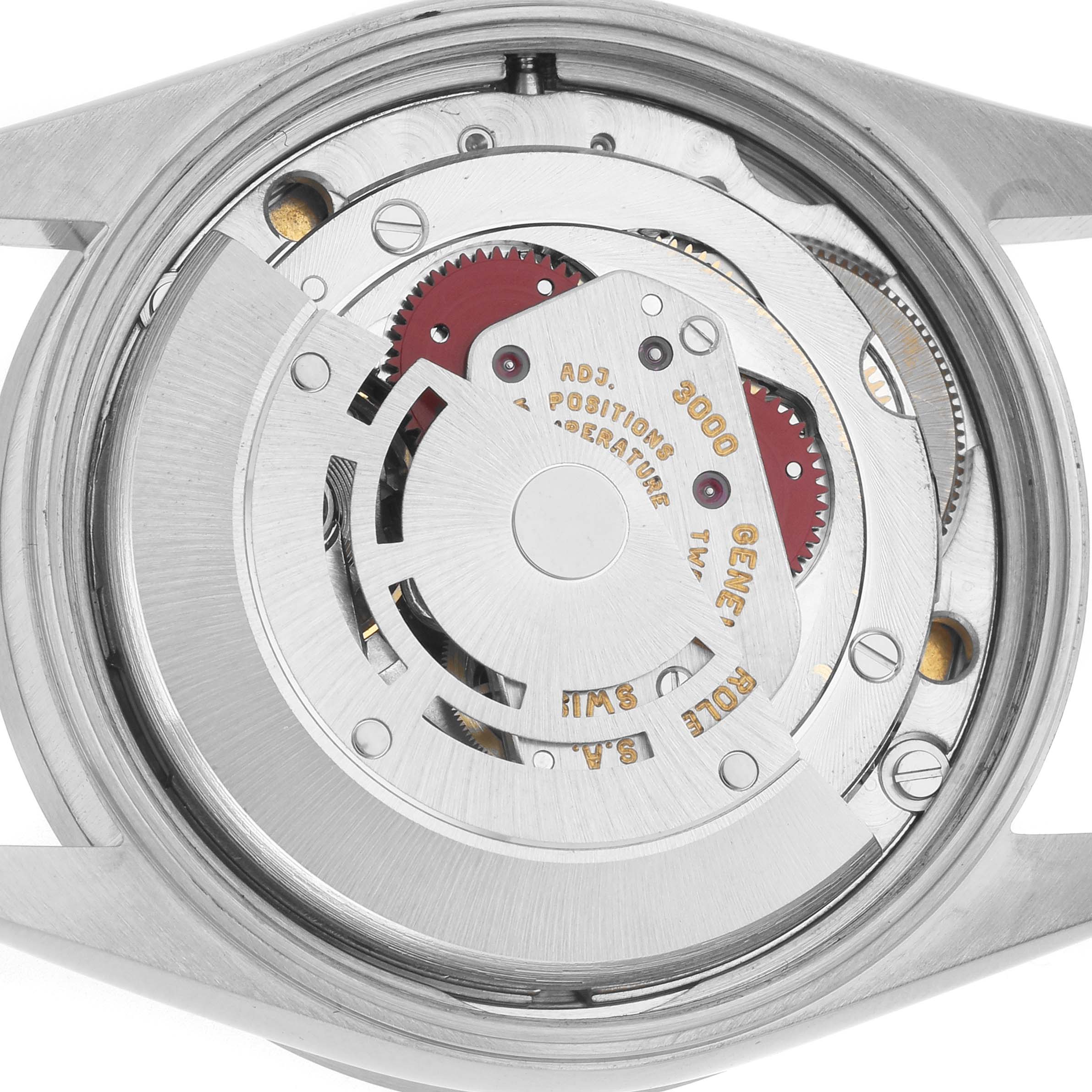 The image shows the internal mechanism of a Rolex Air-King 14010 Men
s Stainless Steel White Dial, viewed from the back, highlighting gears and engravings.