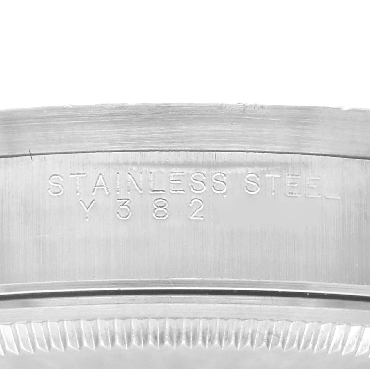 The image shows the side view of a stainless steel casing of a Rolex Air-King 14010M Men's Stainless Steel Black Dial 14010M Men's Stainless Steel Black Dial watch with engraving visible.