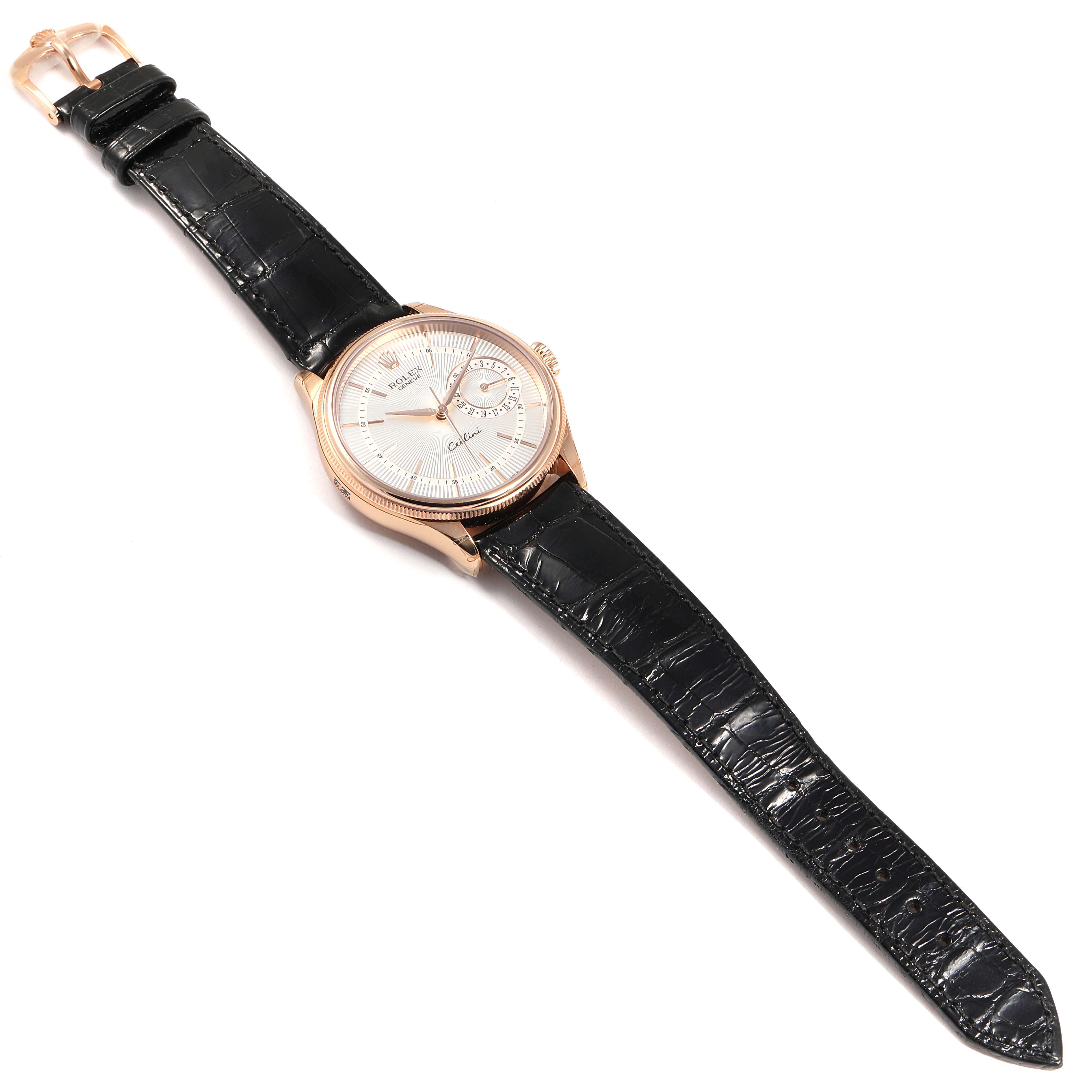 The Rolex Cellini 50515 Men's Rose Gold Silver Dial 50515 Men's Rose Gold Silver Dial watch is shown from a top-down angle, highlighting its face, strap, and clasp.