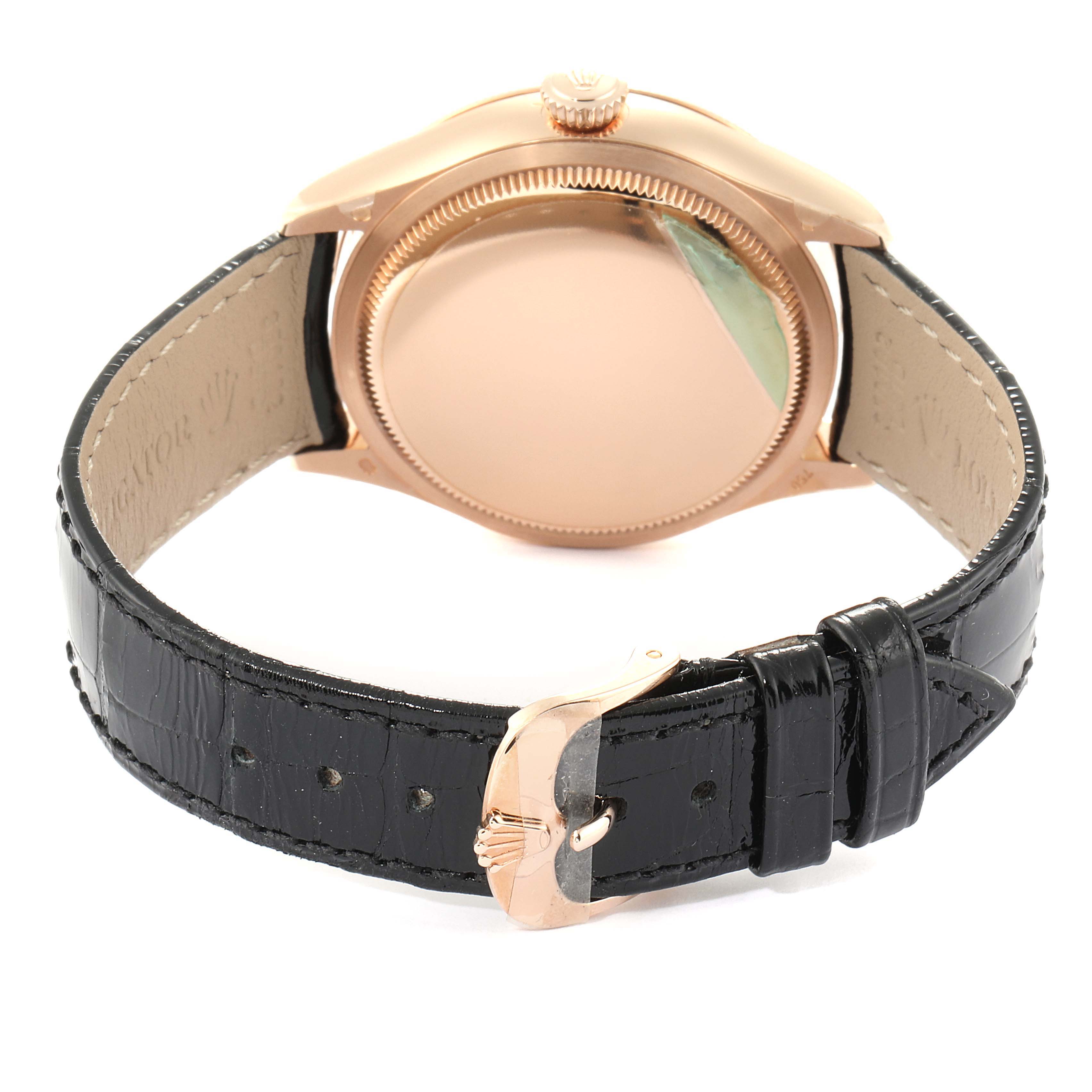 The image shows the back of a Rolex Cellini 50515 Men's Rose Gold Silver Dial 50515 Men's Rose Gold Silver Dial watch and its black leather strap with a rose gold buckle.