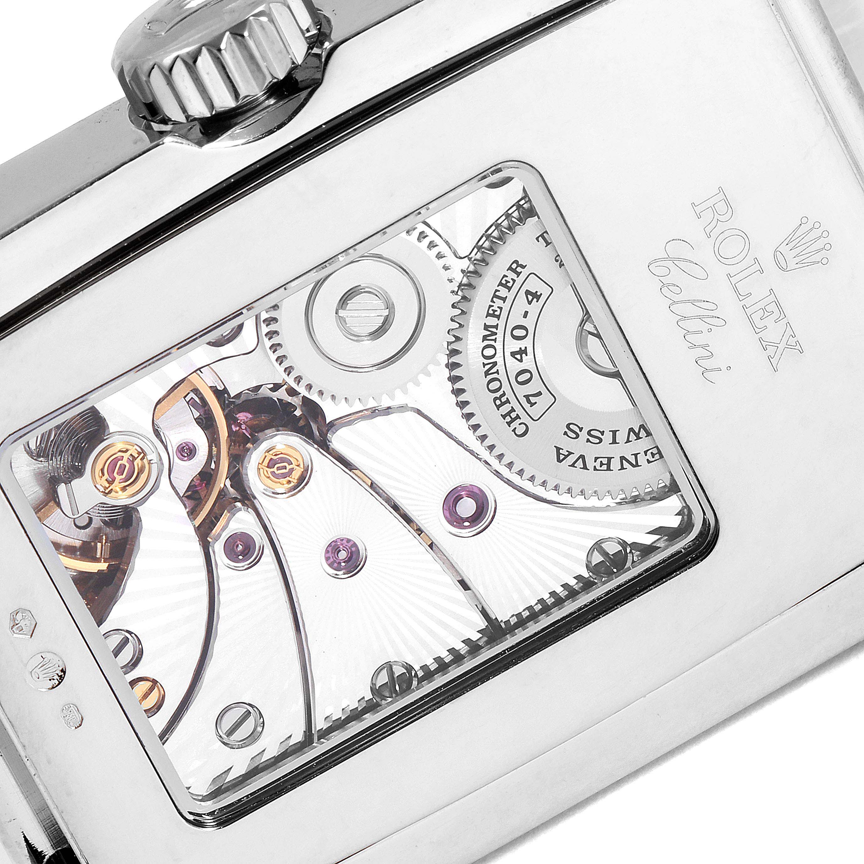 The image shows the back view of a Rolex Cellini 5443/9 Men's White Gold Black Dial 5443/9 Men's White Gold Black Dial watch, highlighting its intricate mechanical movement and internal gears.
