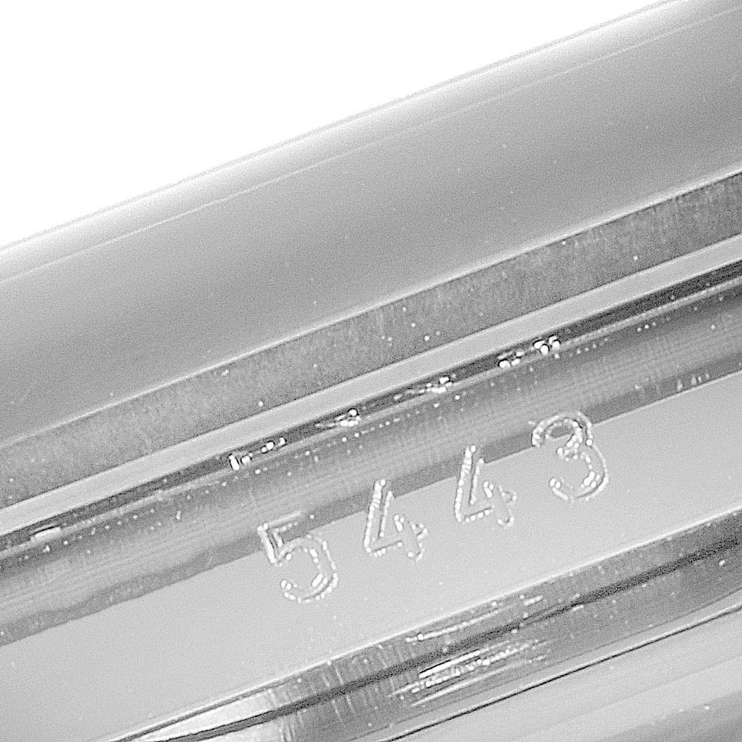 This image shows a close-up of a serial number (5443) engraved on the side of a Rolex Cellini 5443/9 Men's White Gold Black Dial 5443/9 Men's White Gold Black Dial watch.
