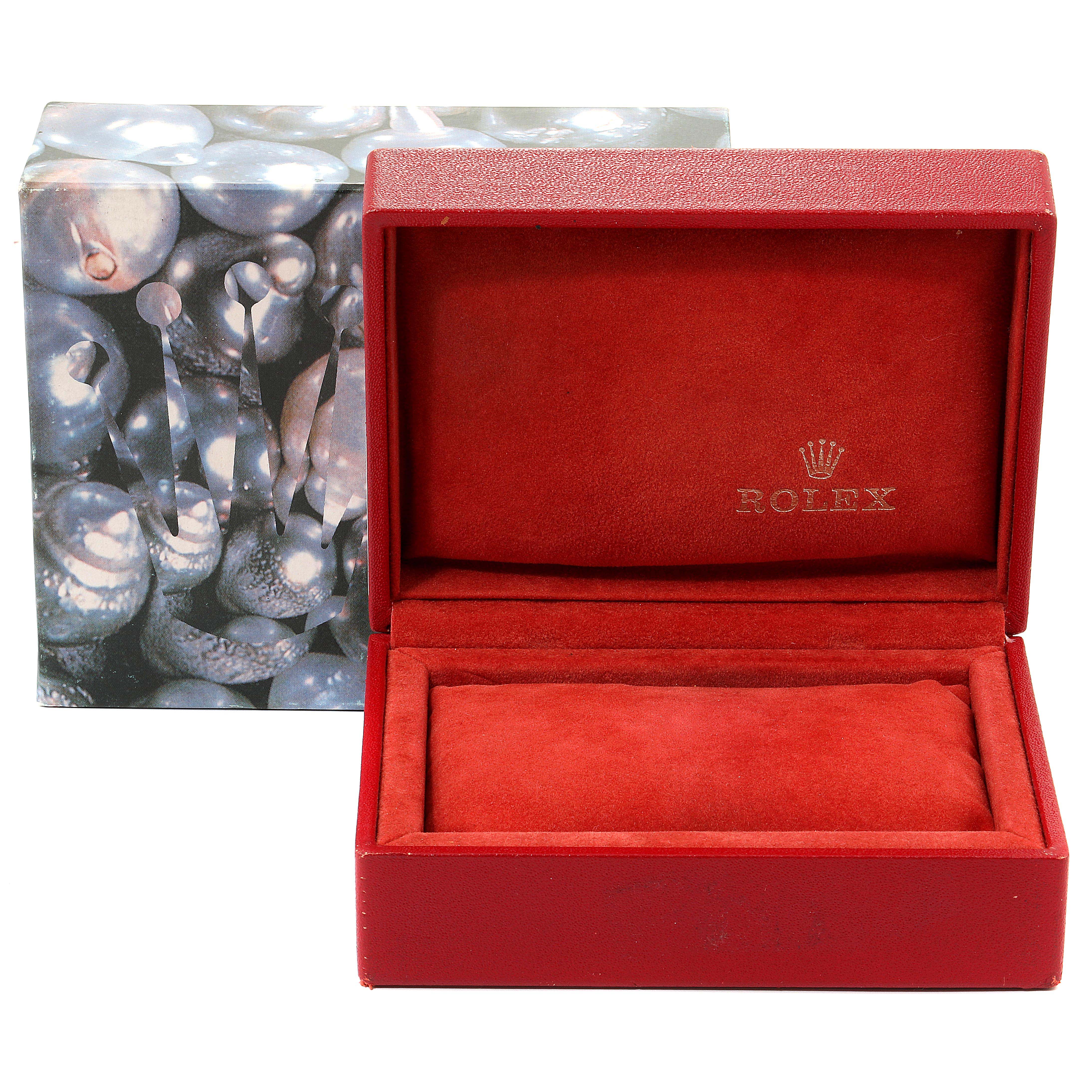 The image shows an open Rolex Datejust 79174 Women's Stainless Steel Black Dial 79174 Women's Stainless Steel Black Dial watch box with a red interior and the brand's logo.