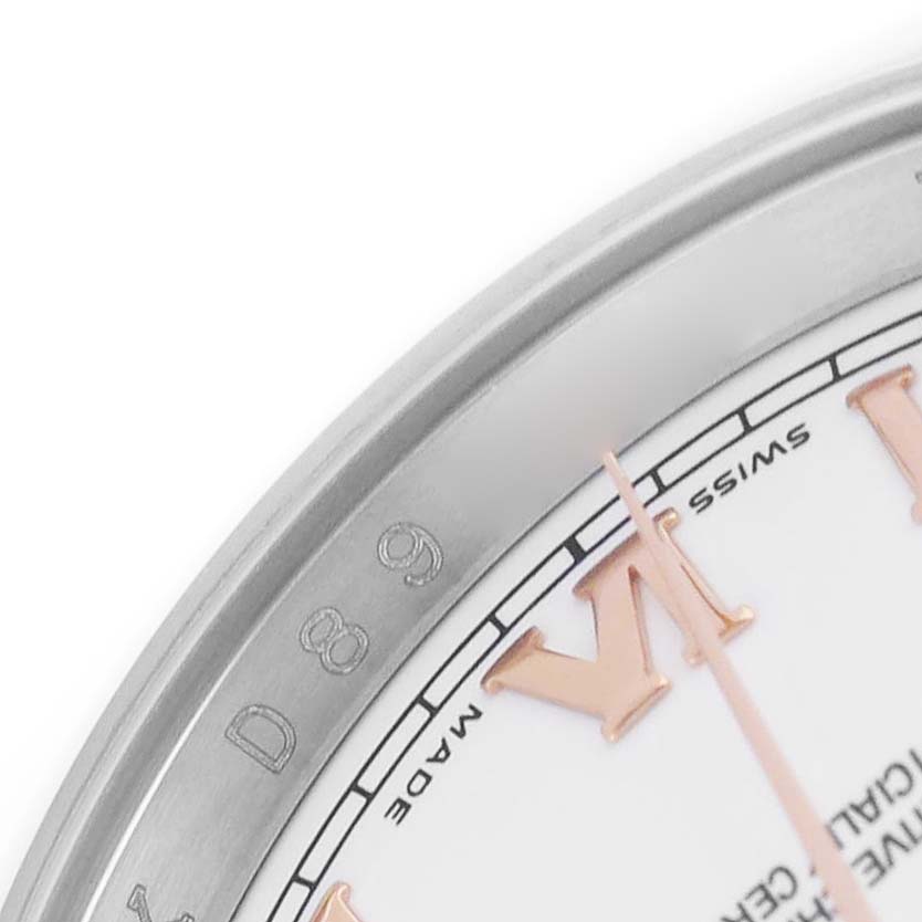 The image shows a close-up of the dial edge and bezel of a Rolex Datejust 116201 Men's Steel and Gold (two tone) White Dial, revealing Roman numerals and text.