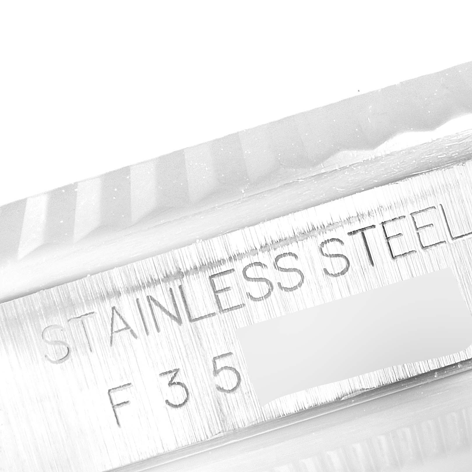 The image shows a close-up of the stainless steel engraving on the Rolex Datejust 16234 Men's Stainless Steel Blue Dial 16234 Men's Stainless Steel Blue Dial watch case.