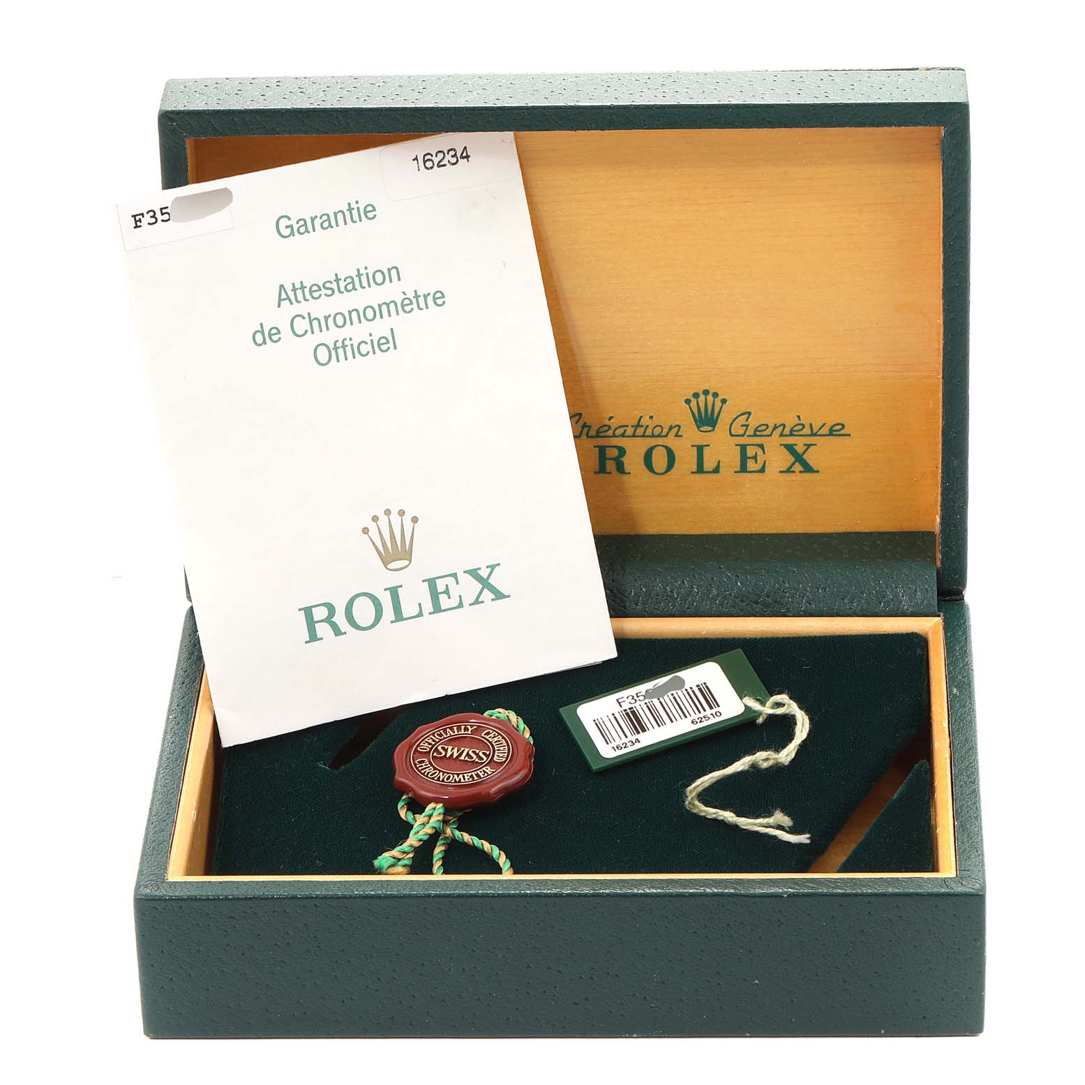 The image shows the packaging and accessories for a Rolex Datejust 16234 Men's Stainless Steel Blue Dial 16234 Men's Stainless Steel Blue Dial watch, including the warranty card and tags.