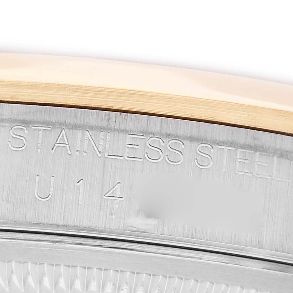 The image shows a close-up of the side engraving on the stainless steel case of a Rolex Datejust 16203 Men's Steel and Gold (two tone) Blue Dial watch.