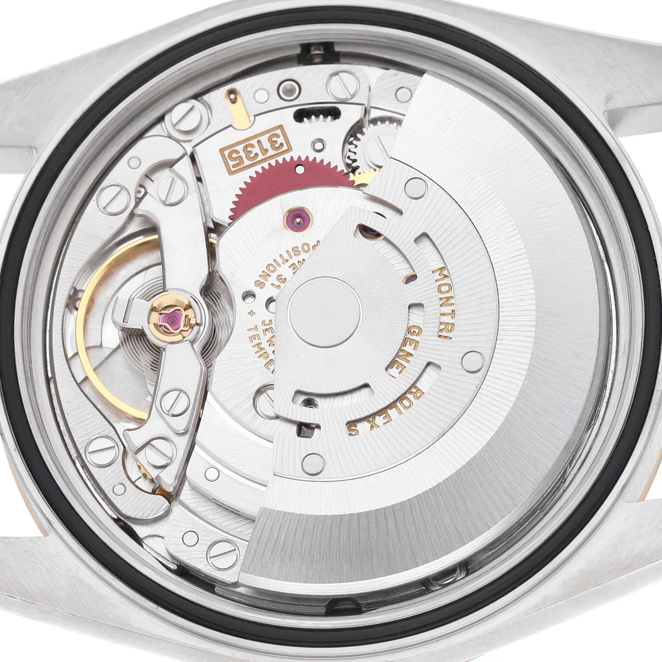 The image shows the Rolex Datejust 16203 Men's Steel and Gold (two tone) Blue Dial's movement from the back, highlighting its intricate mechanical components.