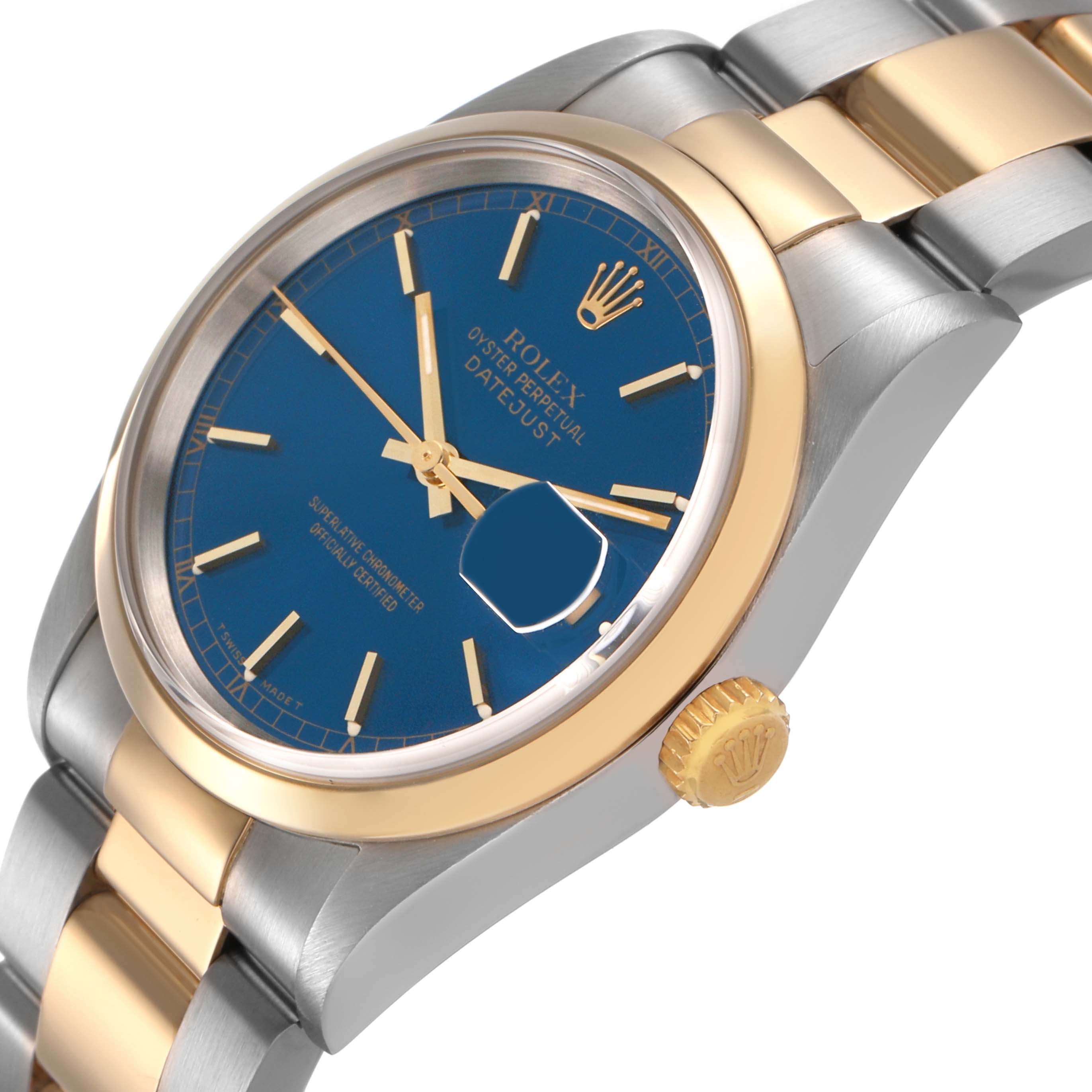 The Rolex Datejust 16203 Men's Steel and Gold (two tone) Blue Dial watch is shown at an angled side view, displaying the bezel, crown, and part of the bracelet.
