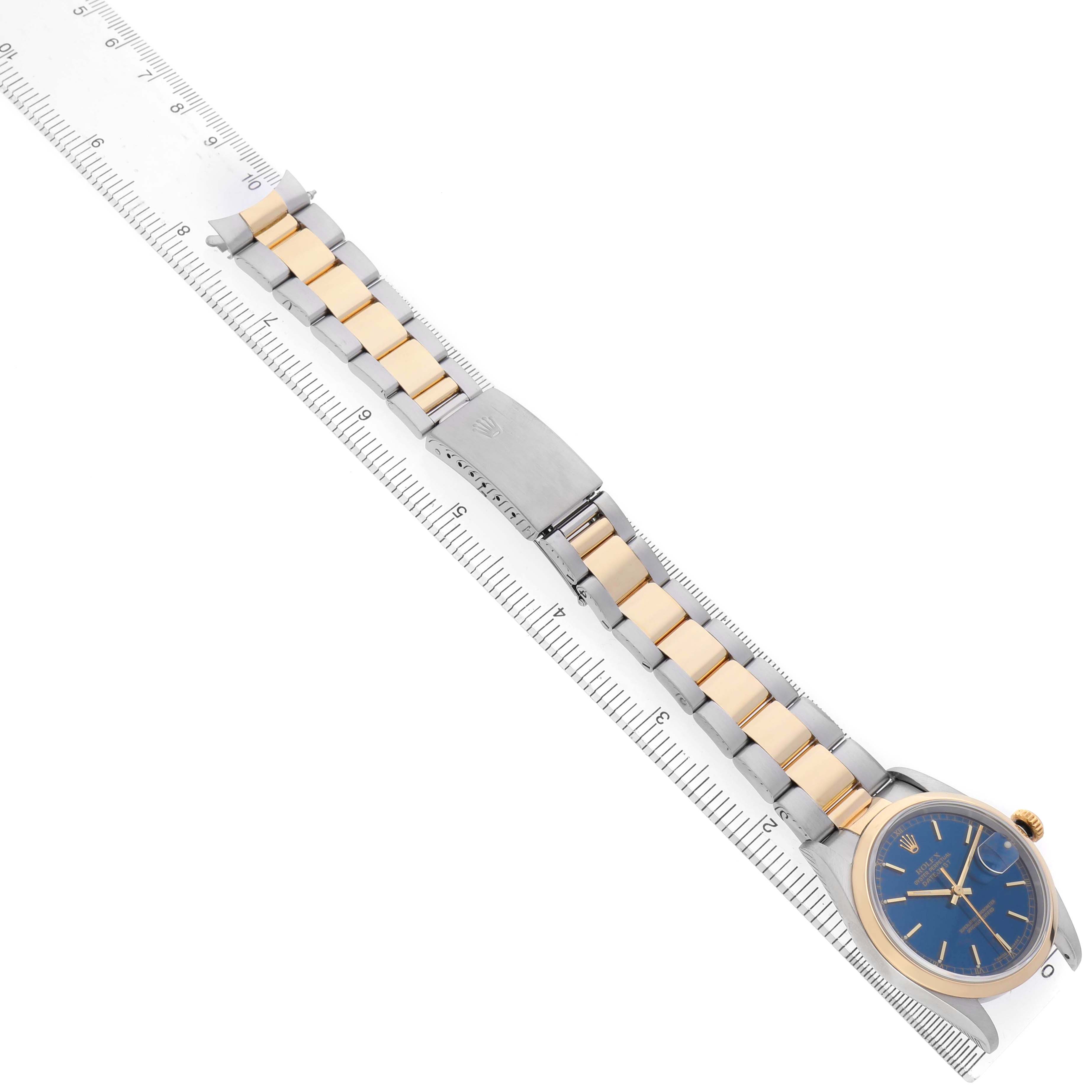 The Rolex Datejust 16203 Men's Steel and Gold (two tone) Blue Dial watch is shown from a top-down angle, highlighting the bracelet, clasp, and blue dial.