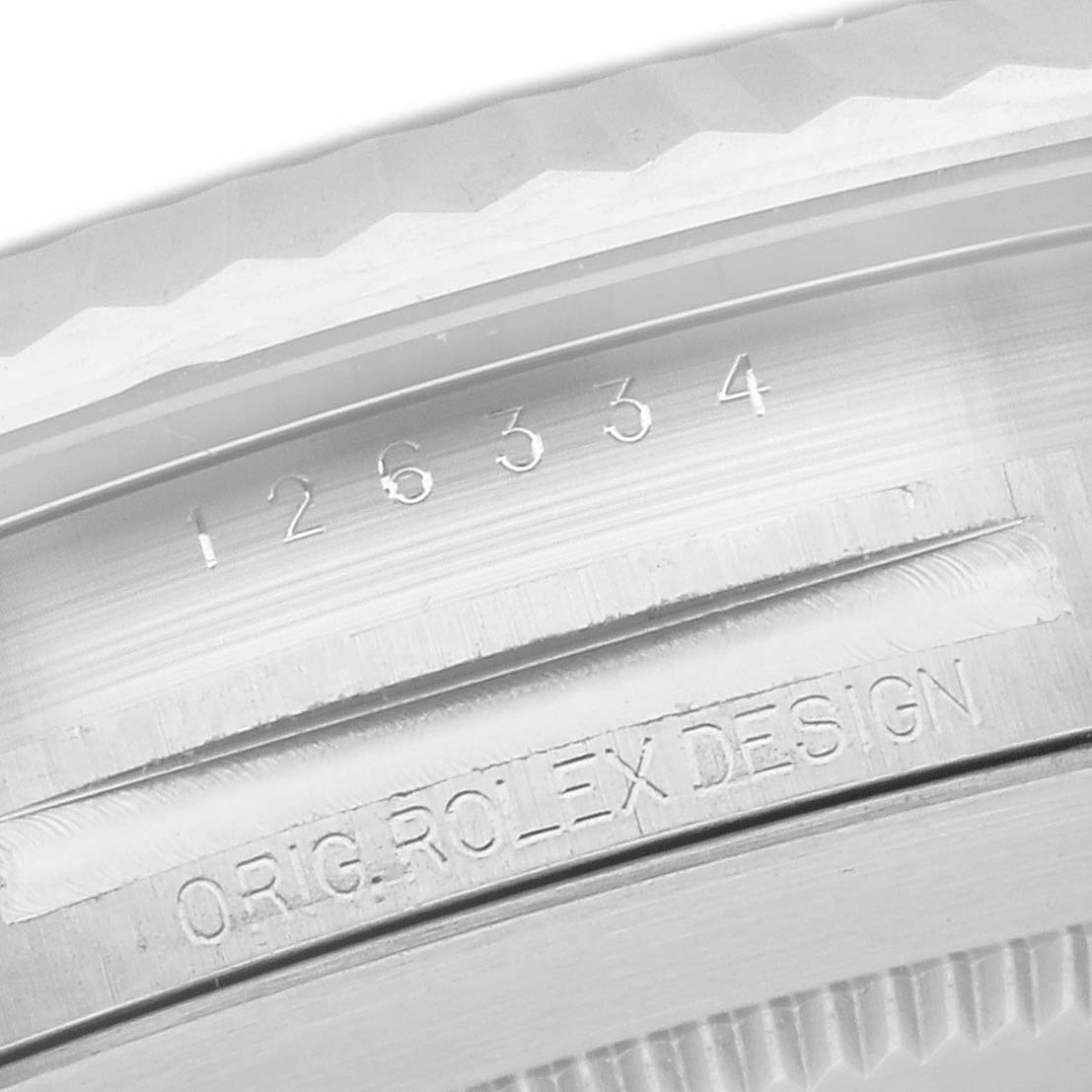 This close-up image shows the model number and "ORIG. ROLEX DESIGN" inscriptions on the casing of the Rolex Datejust 41 126334 Men's Steel and Gold (two tone) White Dial 126334 Men's Steel and Gold (two tone) White Dial watch.