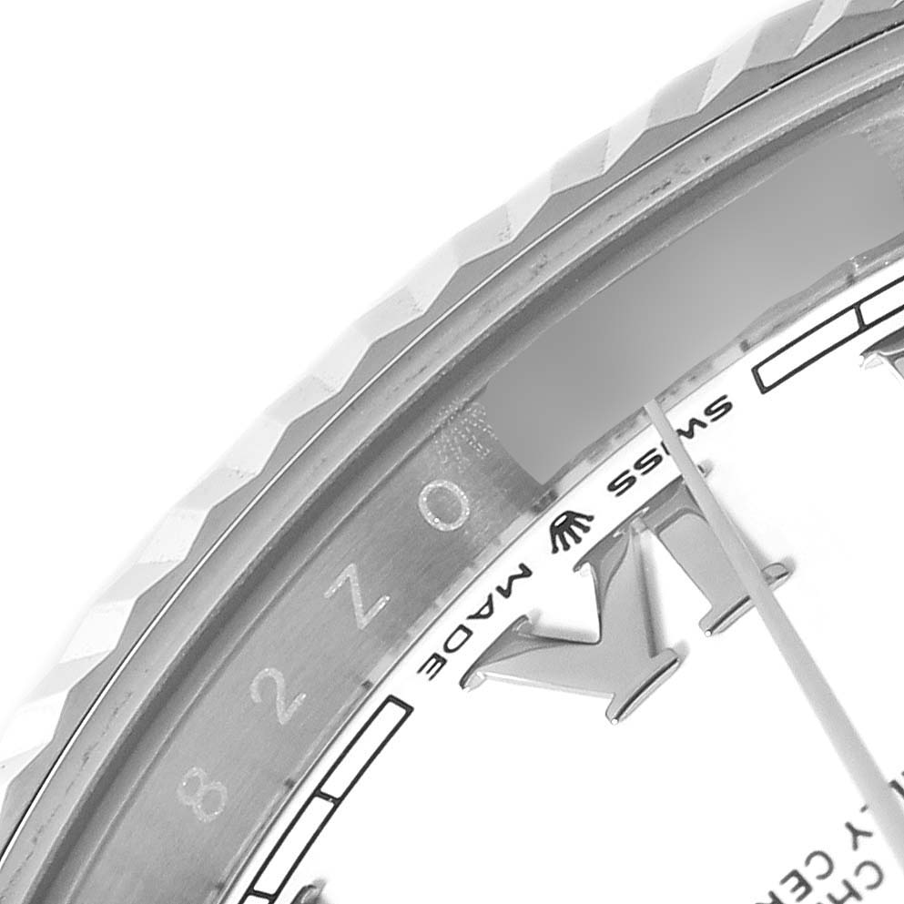 The image shows a close-up of the bezel, part of the dial, and the "Swiss Made" text on the Rolex Datejust 41 126334 Men's Steel and Gold (two tone) White Dial 126334 Men's Steel and Gold (two tone) White Dial model.