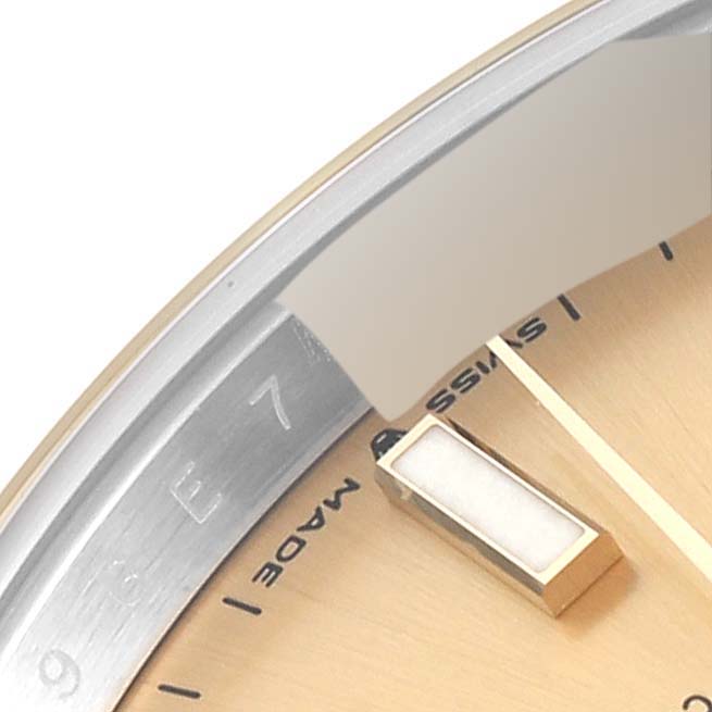 The image shows a close-up view of the Rolex Datejust 41 126303 Men's Steel and Gold (two tone) Champagne Dial 126303 Men's Steel and Gold (two tone) Champagne Dial watch dial and bezel.