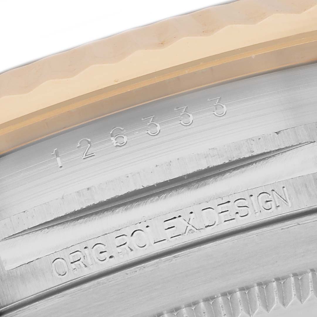 The image shows a close-up of the engraving on the case of a Rolex Datejust 41 126333 Men's Steel and Gold (two tone) Grey Dial 126333 Men's Steel and Gold (two tone) Grey Dial watch, focusing on the model number and design inscription.