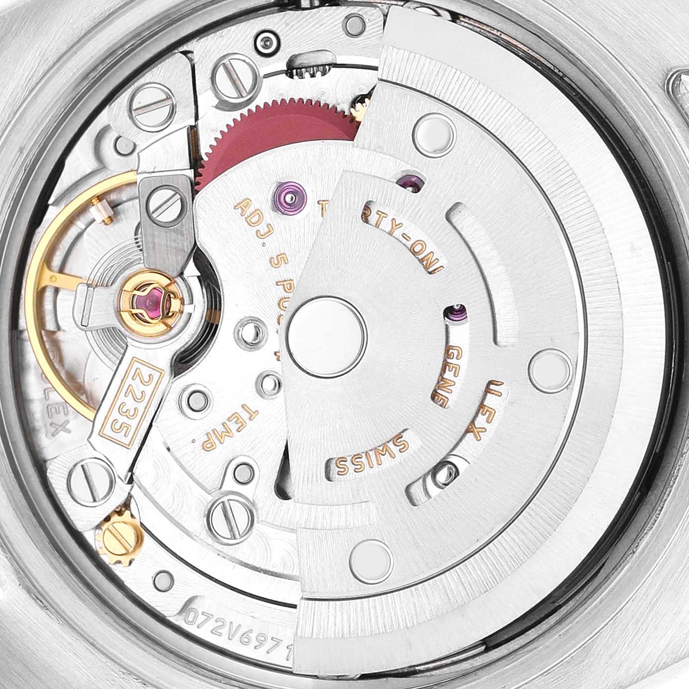 The image shows the movement of a Rolex Datejust 179171 Women's Steel and Gold (two tone) Silver Dial watch, highlighting its rotor and intricate mechanical parts.