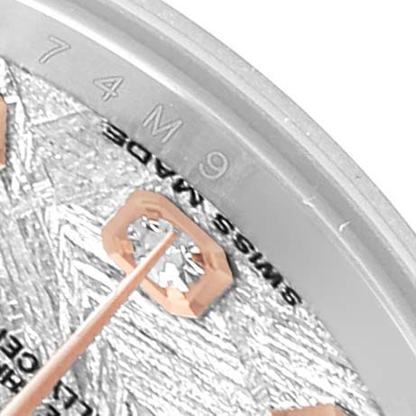 The image shows a close-up of the dial and indices of a Rolex Datejust 179171 Women's Steel and Gold (two tone) Silver Dial watch, highlighting the “Swiss Made” text and the textured pattern.
